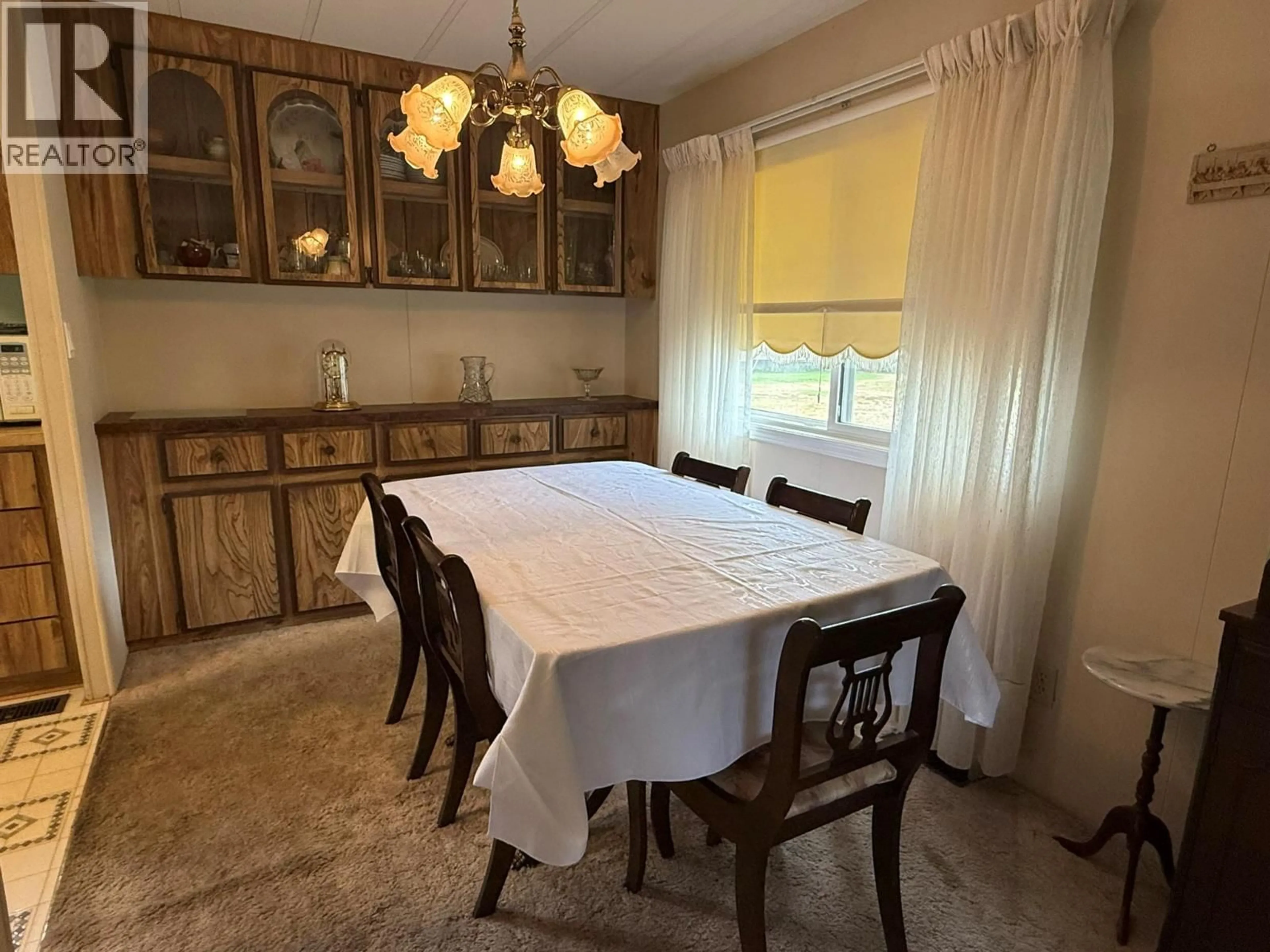 Dining room, wood/laminate floor for 231 - 3105 SOUTH MAIN STREET, Penticton British Columbia V2A7H1