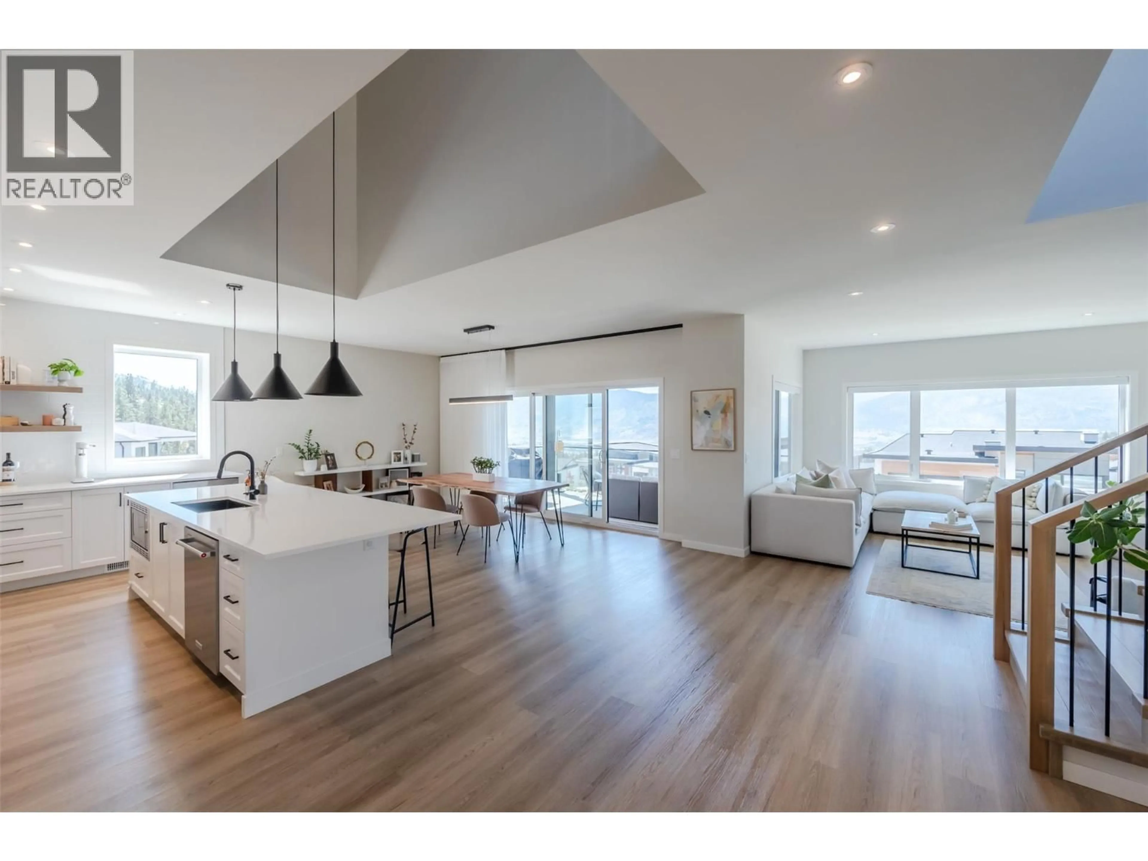 Open concept kitchen, wood/laminate floor for 174 FAWN COURT, Penticton British Columbia V2A0C8
