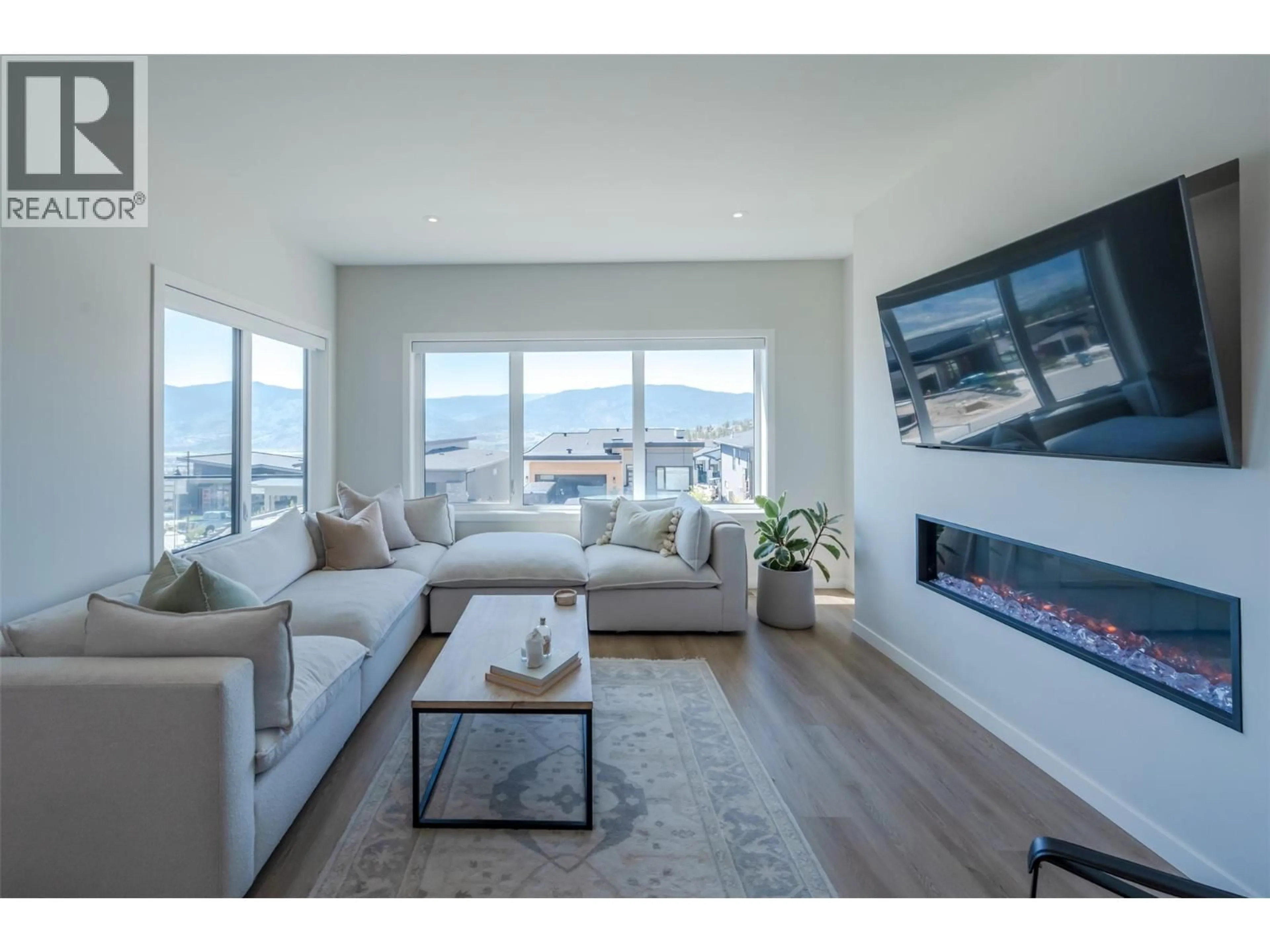 Living room with furniture, wood/laminate floor for 174 FAWN COURT, Penticton British Columbia V2A0C8