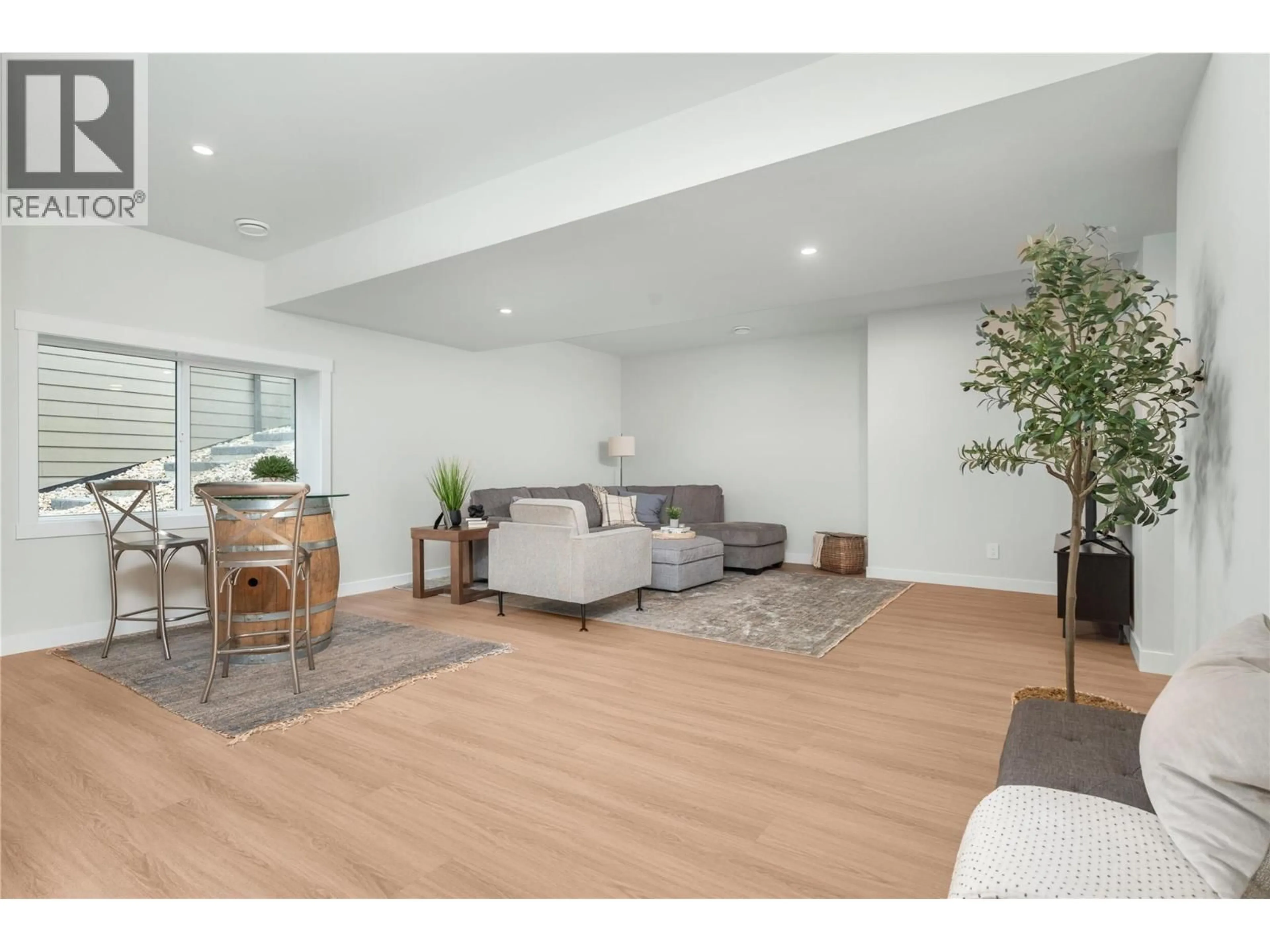 Living room with furniture, wood/laminate floor for 131 - 7760 OKANAGAN LANDING ROAD, Okanagan Landing British Columbia V1H1H2