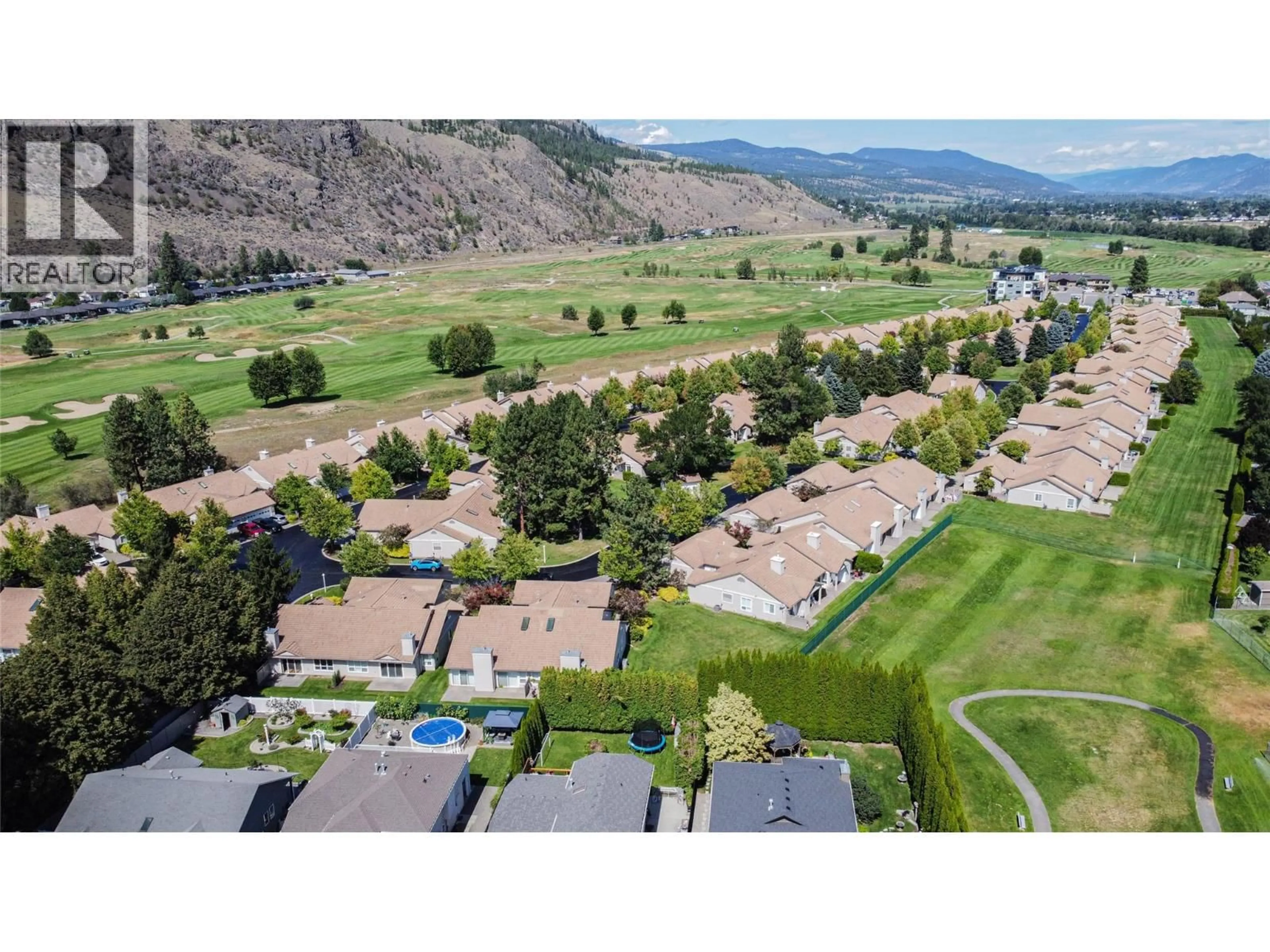 A pic from outside/outdoor area/front of a property/back of a property/a pic from drone, mountain view for 102 - 650 HARRINGTON ROAD, Kamloops British Columbia V2B6T7