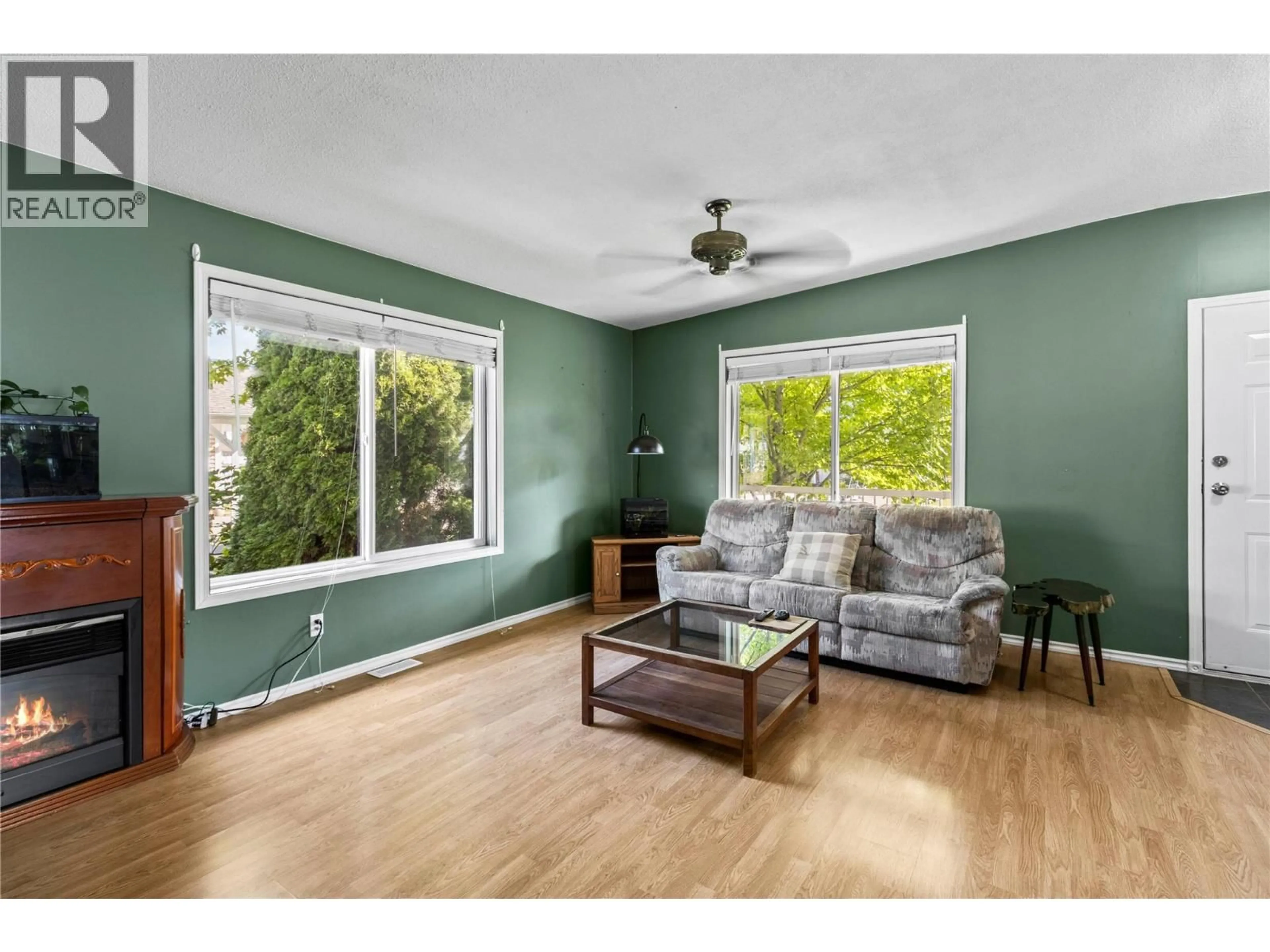 Living room with furniture, wood/laminate floor for 7251 48 STREET NORTHEAST, Salmon Arm British Columbia V0E1K0