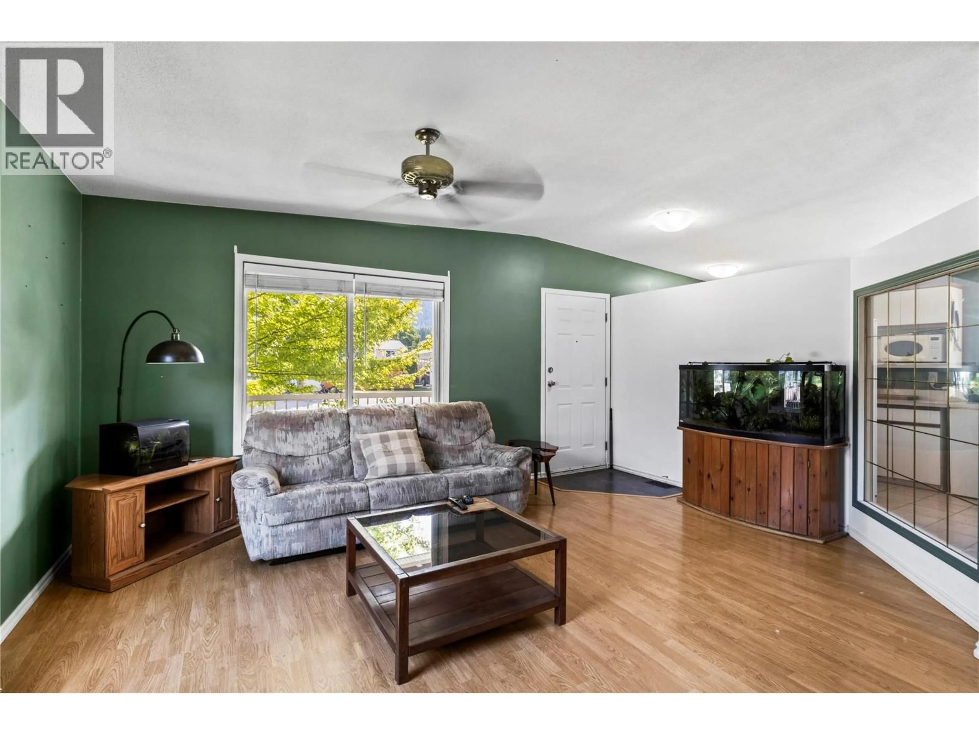 Living room with furniture, wood/laminate floor for 7251 48 STREET NORTHEAST, Salmon Arm British Columbia V0E1K0