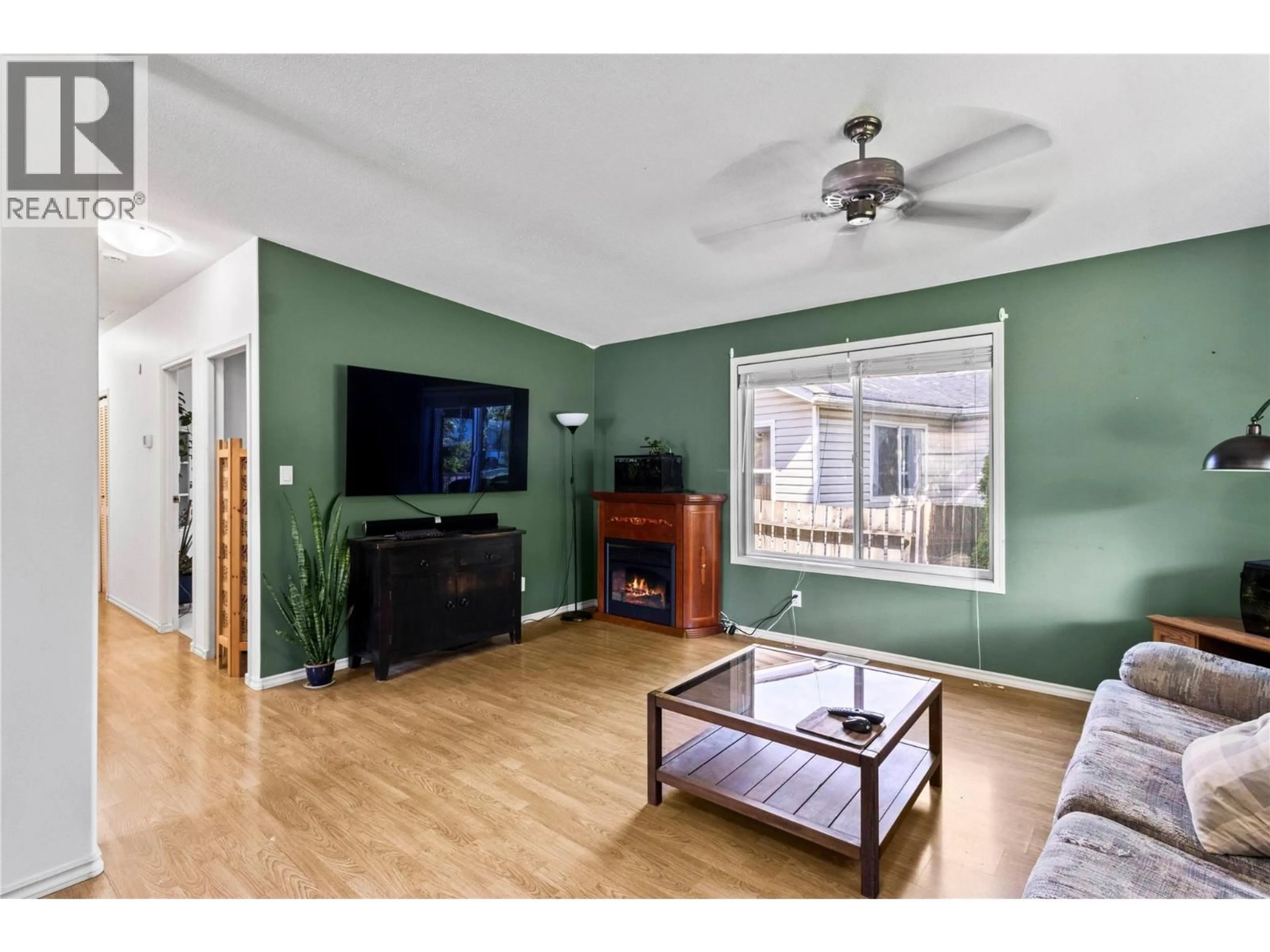 Living room with furniture, wood/laminate floor for 7251 48 STREET NORTHEAST, Salmon Arm British Columbia V0E1K0
