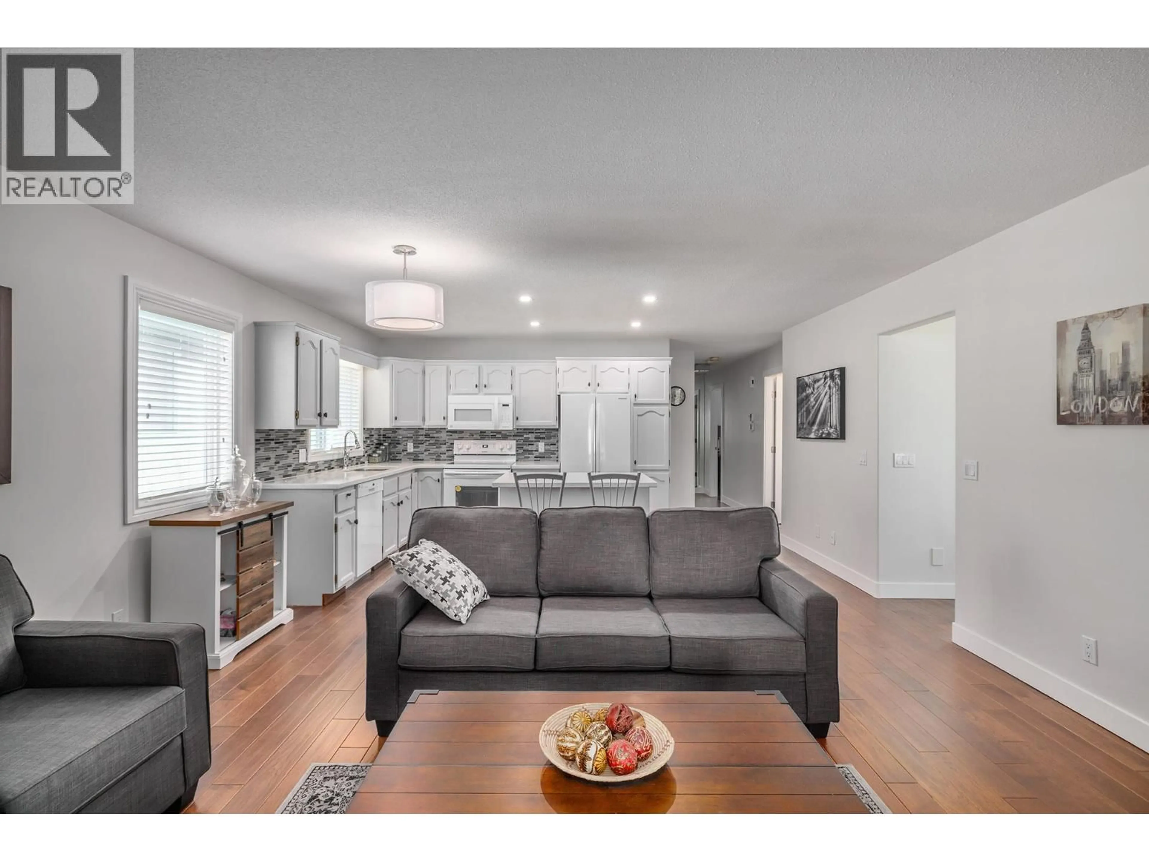 Open concept kitchen, wood/laminate floor for 70 - 615 GLENMEADOWS ROAD, Kelowna British Columbia V1V1N9