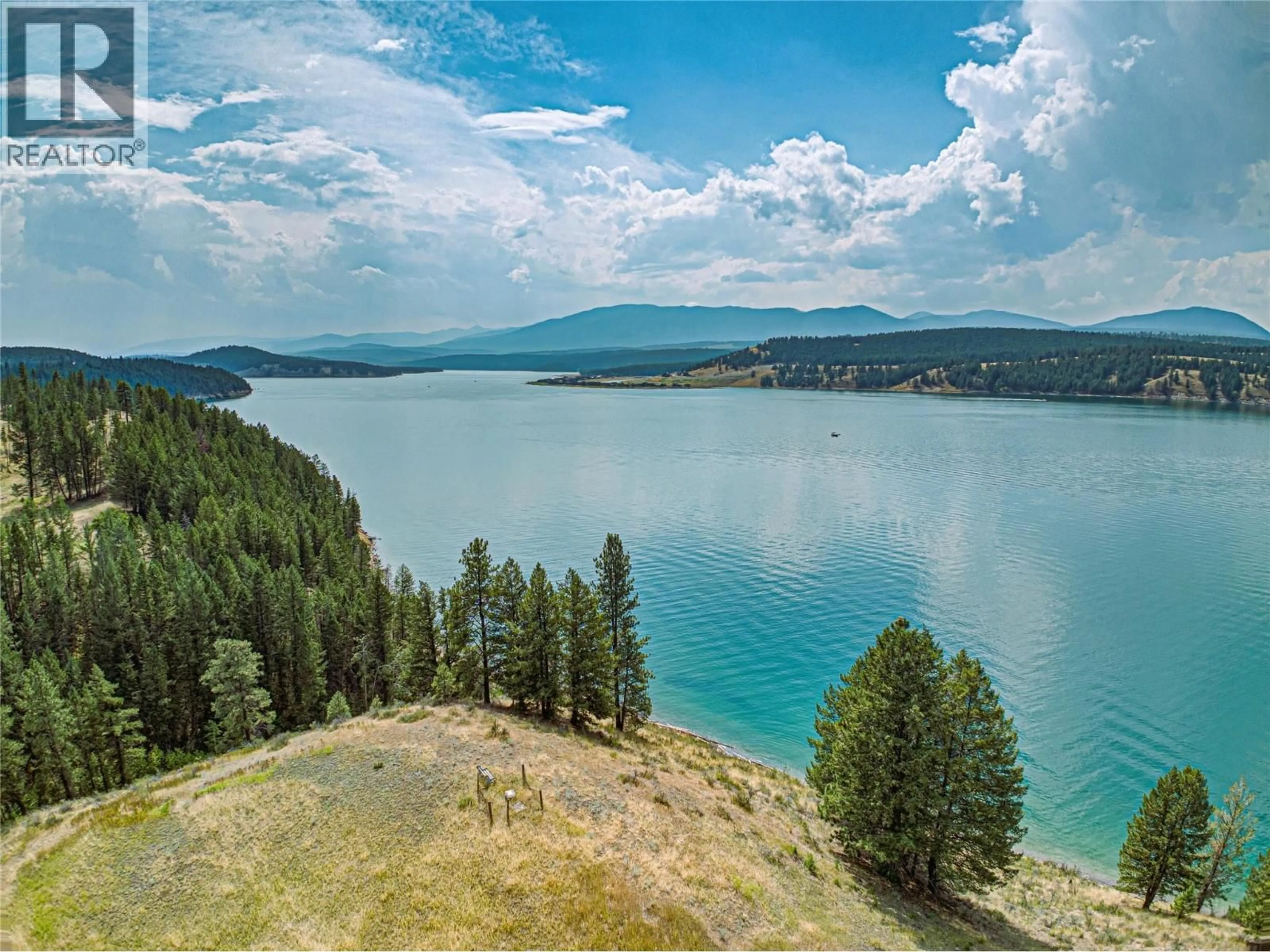 A pic from outside/outdoor area/front of a property/back of a property/a pic from drone, water/lake/river/ocean view for 1347 WALDO ROAD, Baynes Lake British Columbia V0B1T4