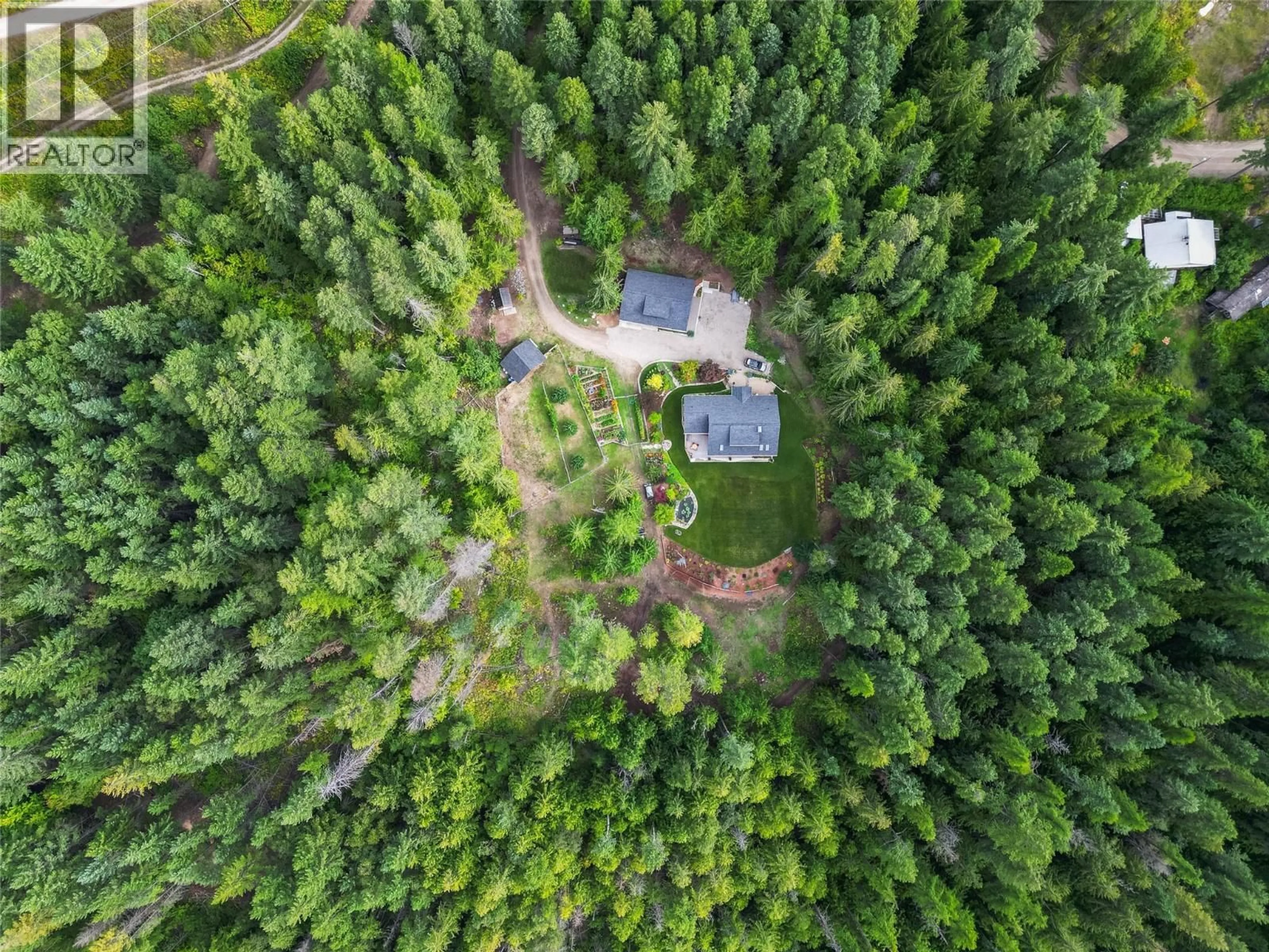 A pic from outside/outdoor area/front of a property/back of a property/a pic from drone, forest/trees view for 6968 BEGGS ROAD, Nelson British Columbia V1L6S5