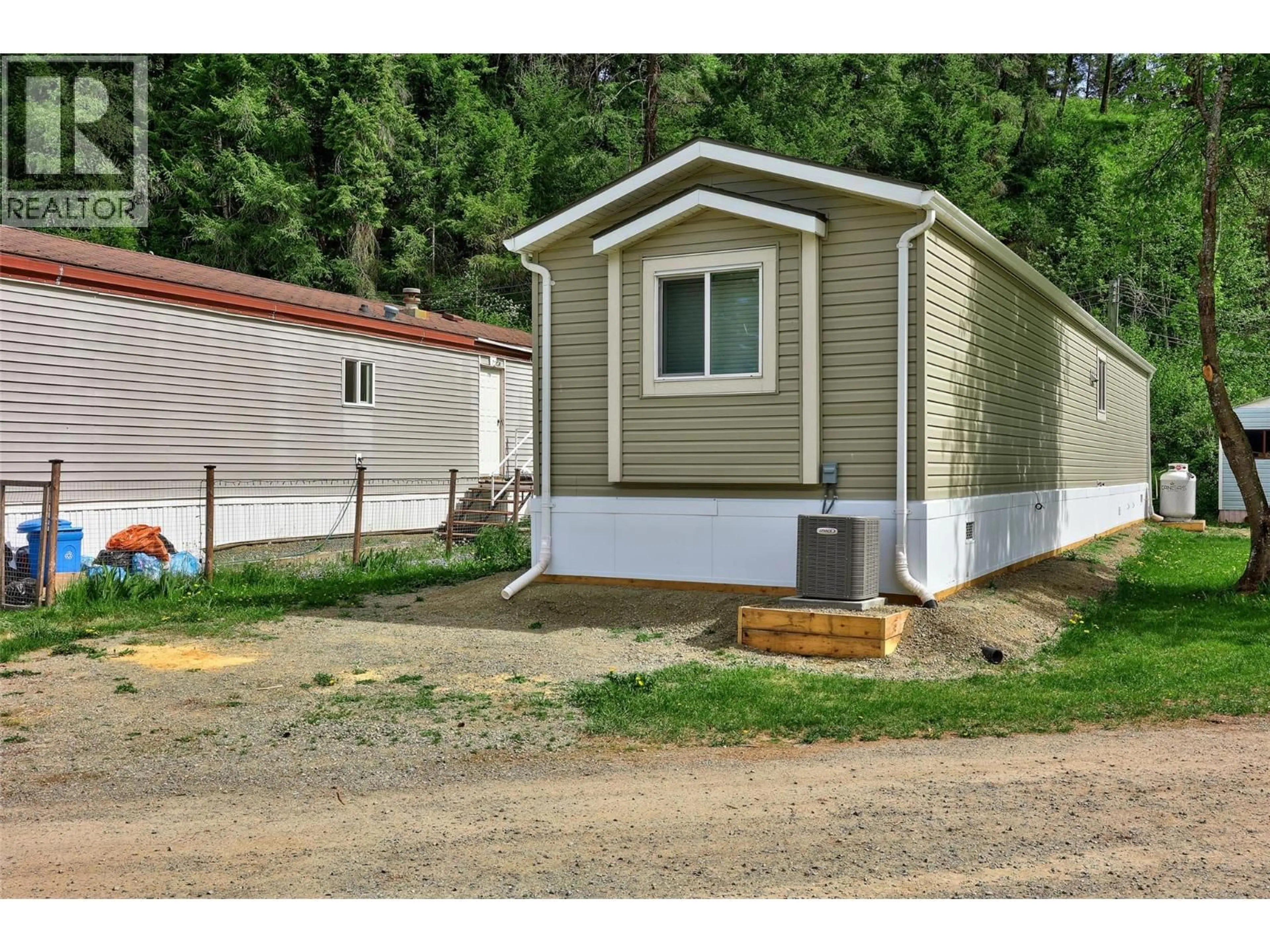 Home with vinyl exterior material, street for 11 - 4428 BARRIERE TOWN ROAD, Barriere British Columbia V0E1E0