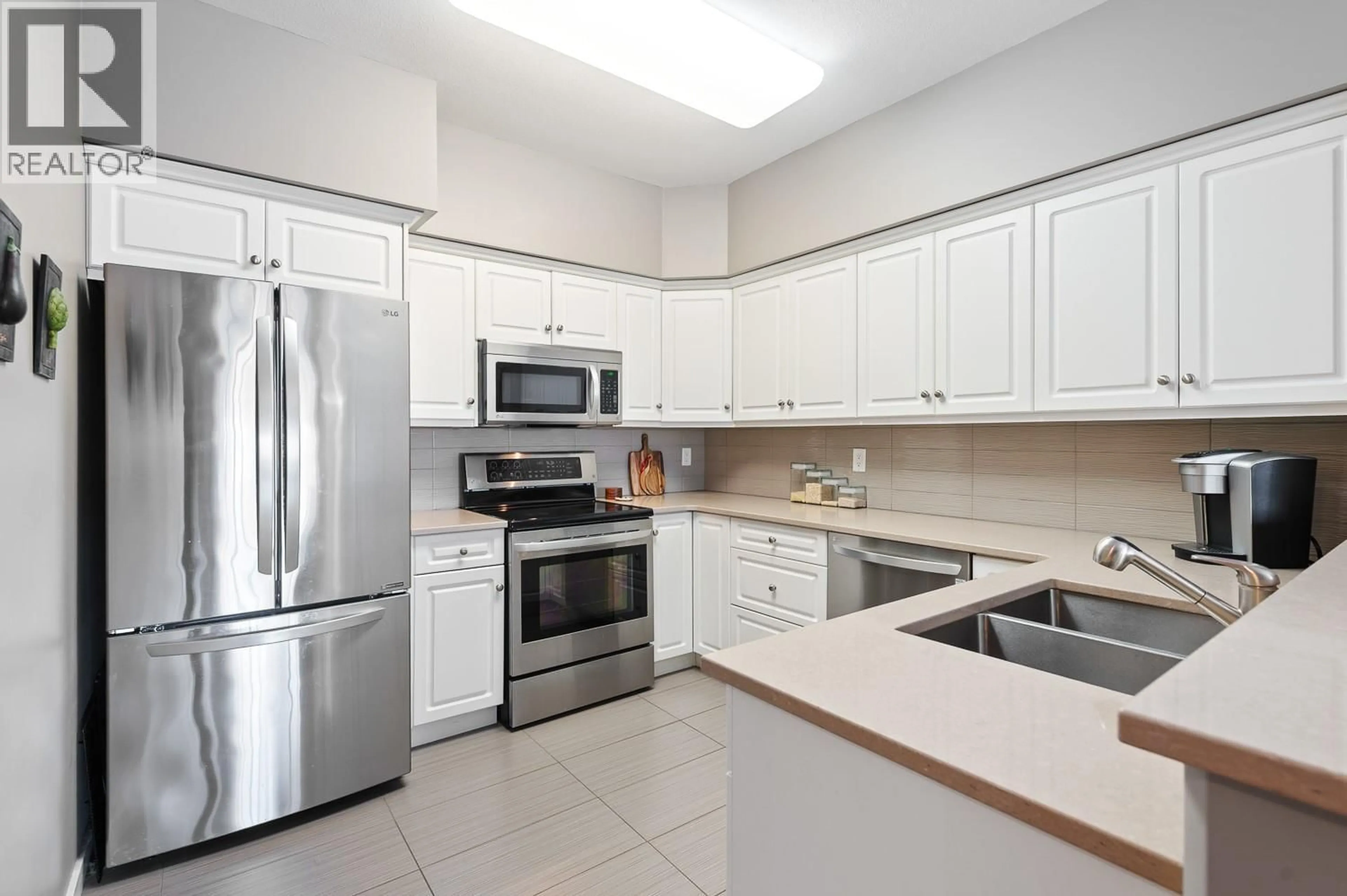 Standard kitchen, ceramic/tile floor for 201 - 688 LEQUIME ROAD, Kelowna British Columbia V1W1A6