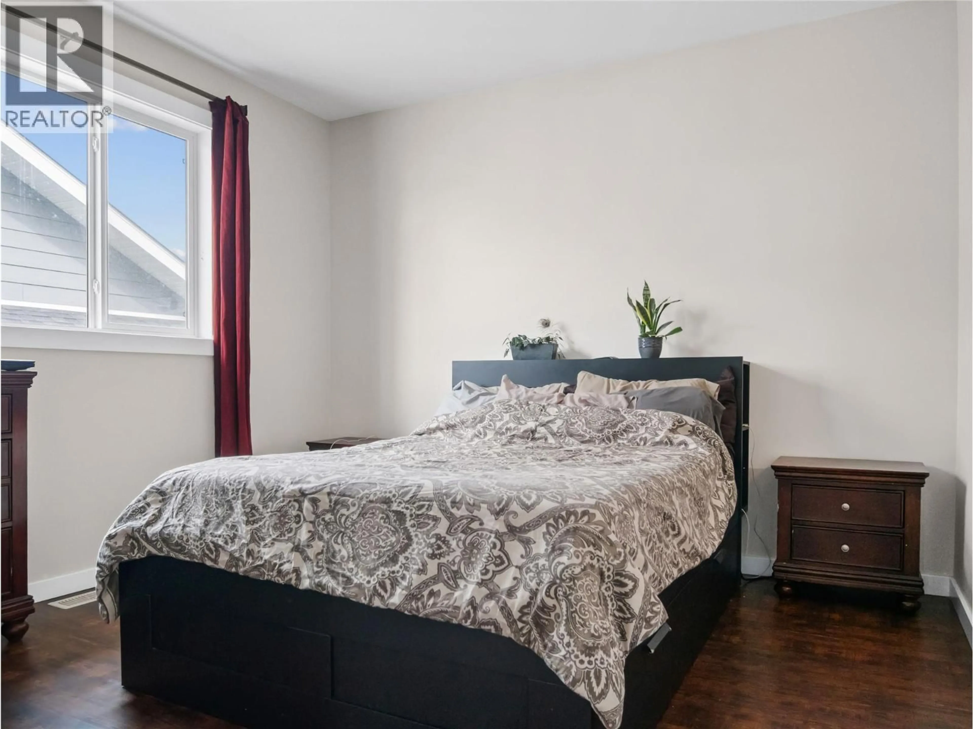 Bedroom with bed, wood/laminate floor for 4830 ELEVATOR ROAD, Pouce Coupe British Columbia V0C2C0