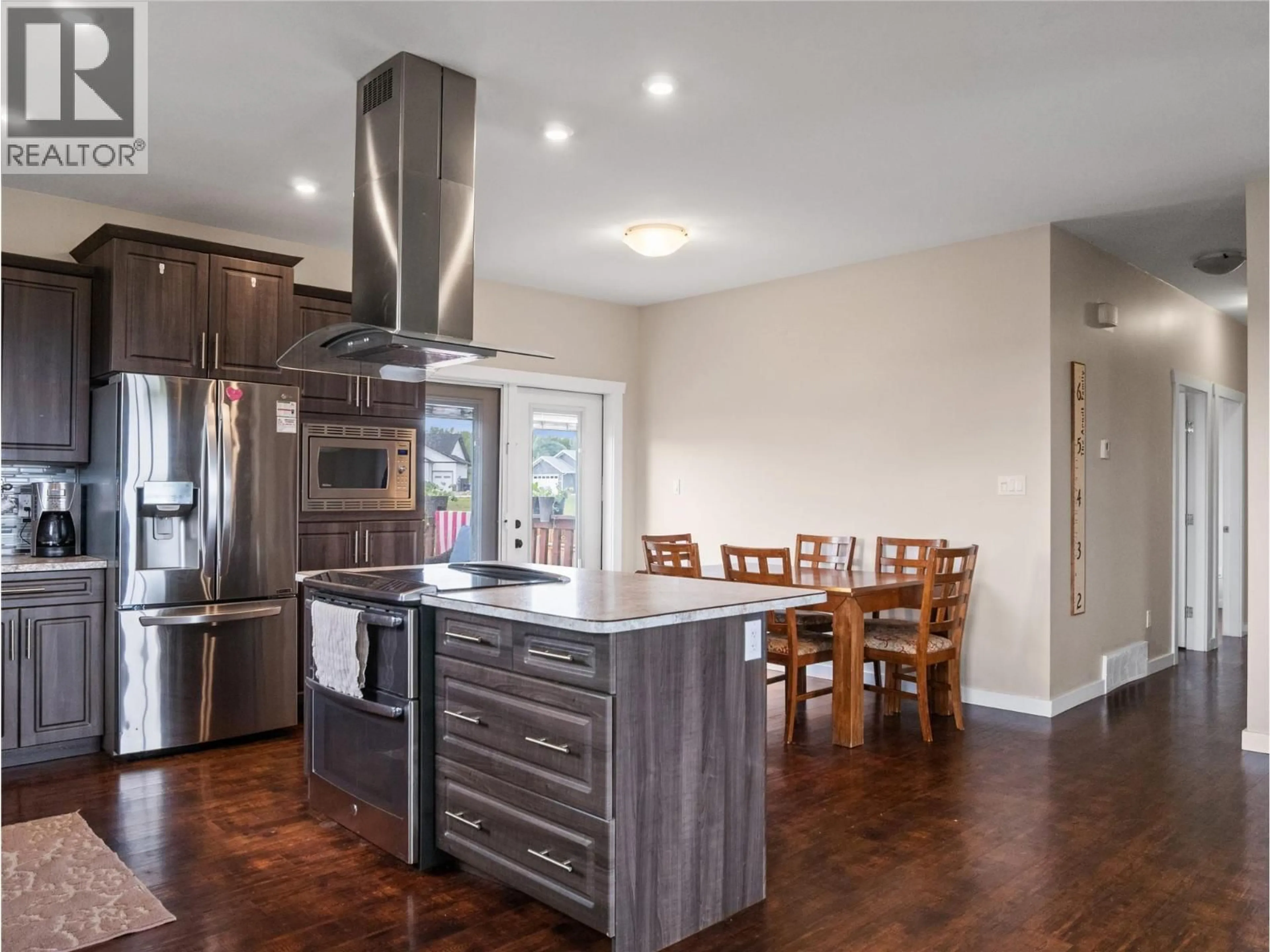 Open concept kitchen, wood/laminate floor for 4830 ELEVATOR ROAD, Pouce Coupe British Columbia V0C2C0