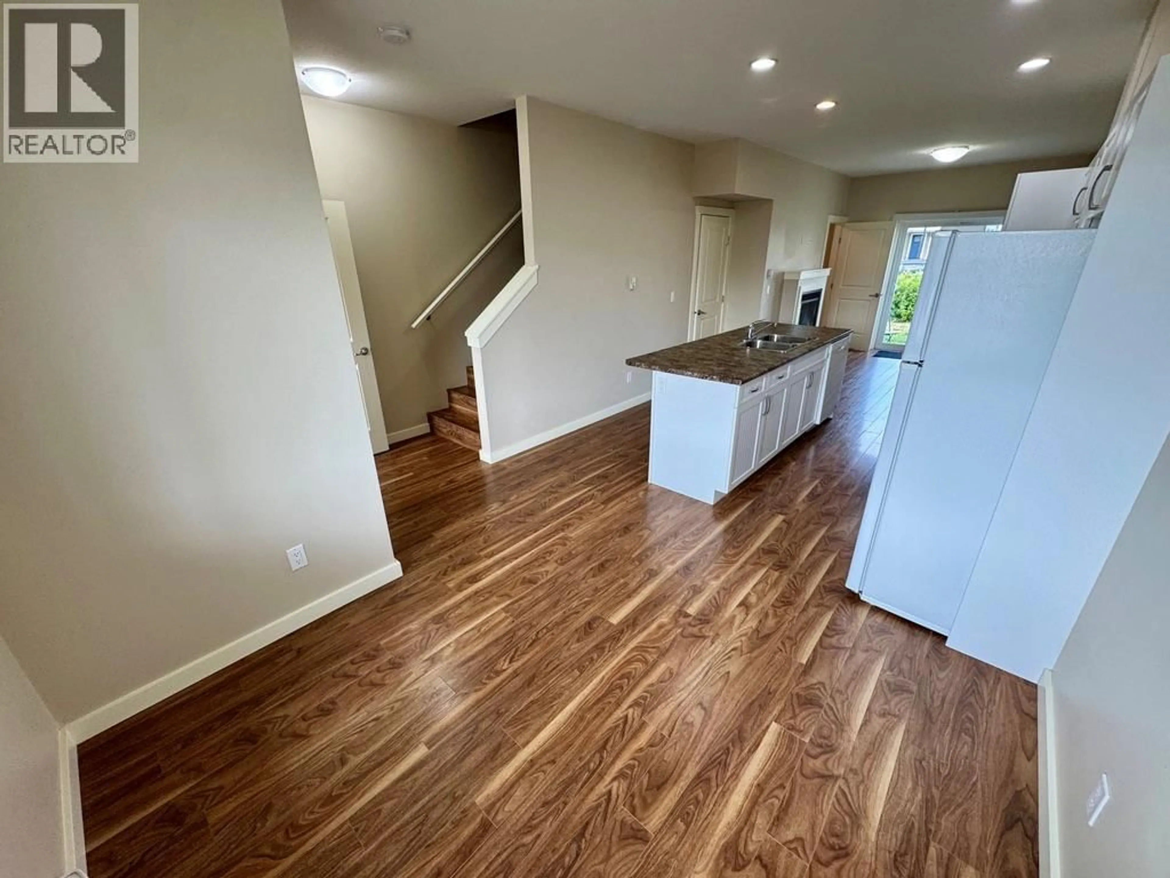 Open concept kitchen, wood/laminate floor for 503 - 1617 88 AVENUE, Dawson Creek British Columbia V1G0E8