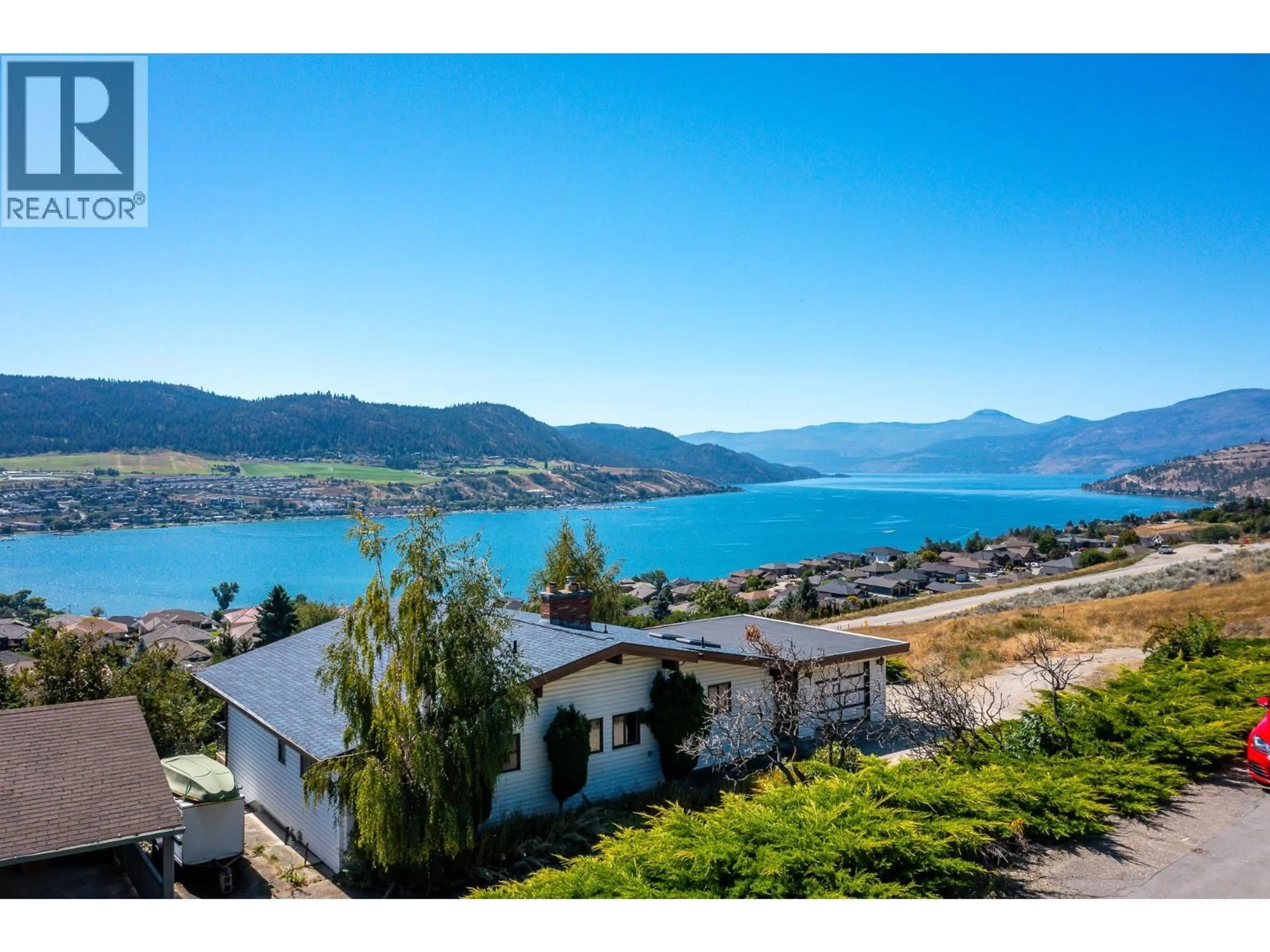 A pic from outside/outdoor area/front of a property/back of a property/a pic from drone, water/lake/river/ocean view for 7096 APPALOOSA WAY, Vernon British Columbia V1H1B9