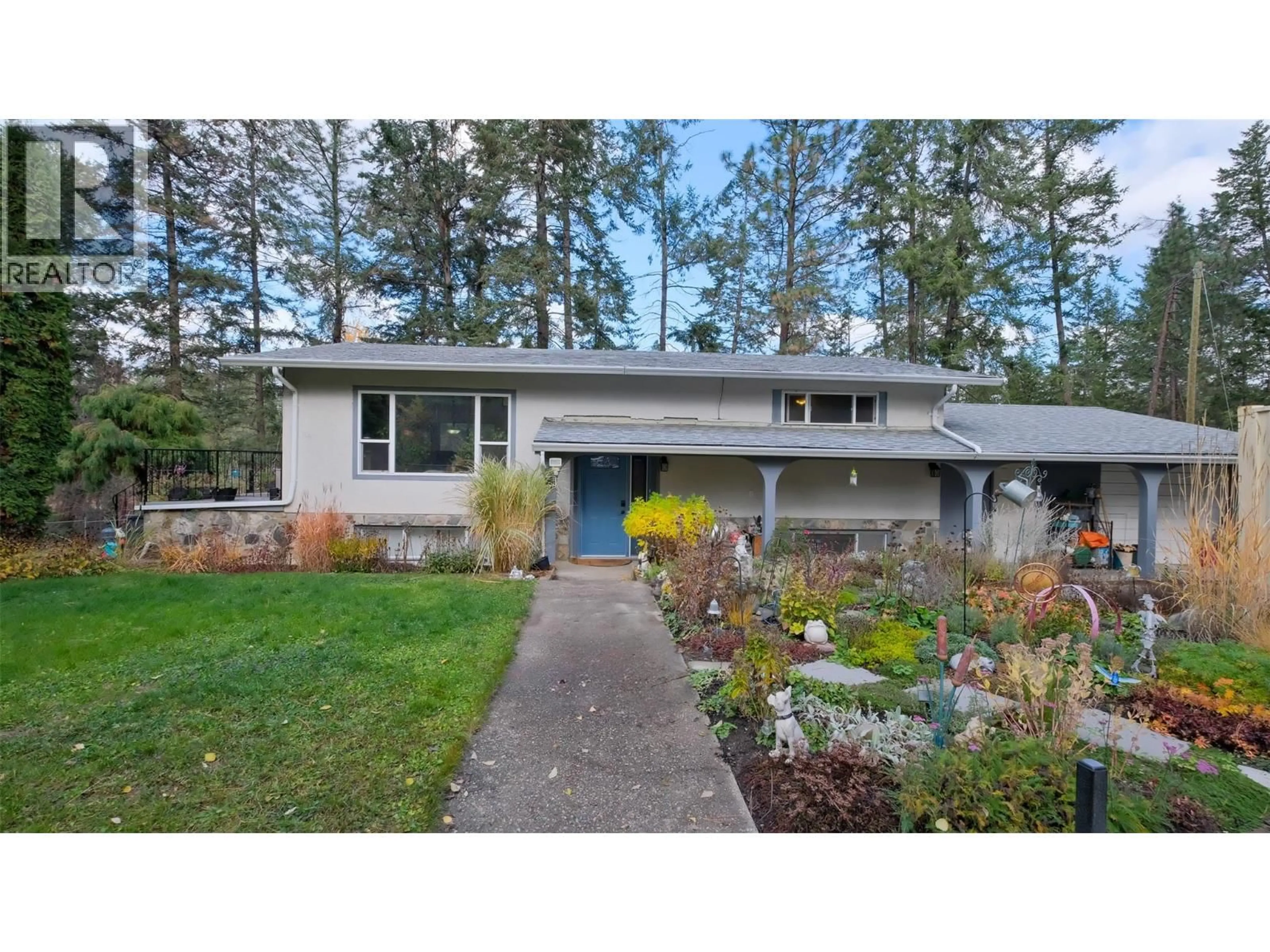 Home with vinyl exterior material, street for 4099 MILLER ROAD, Kelowna British Columbia V1W4C7