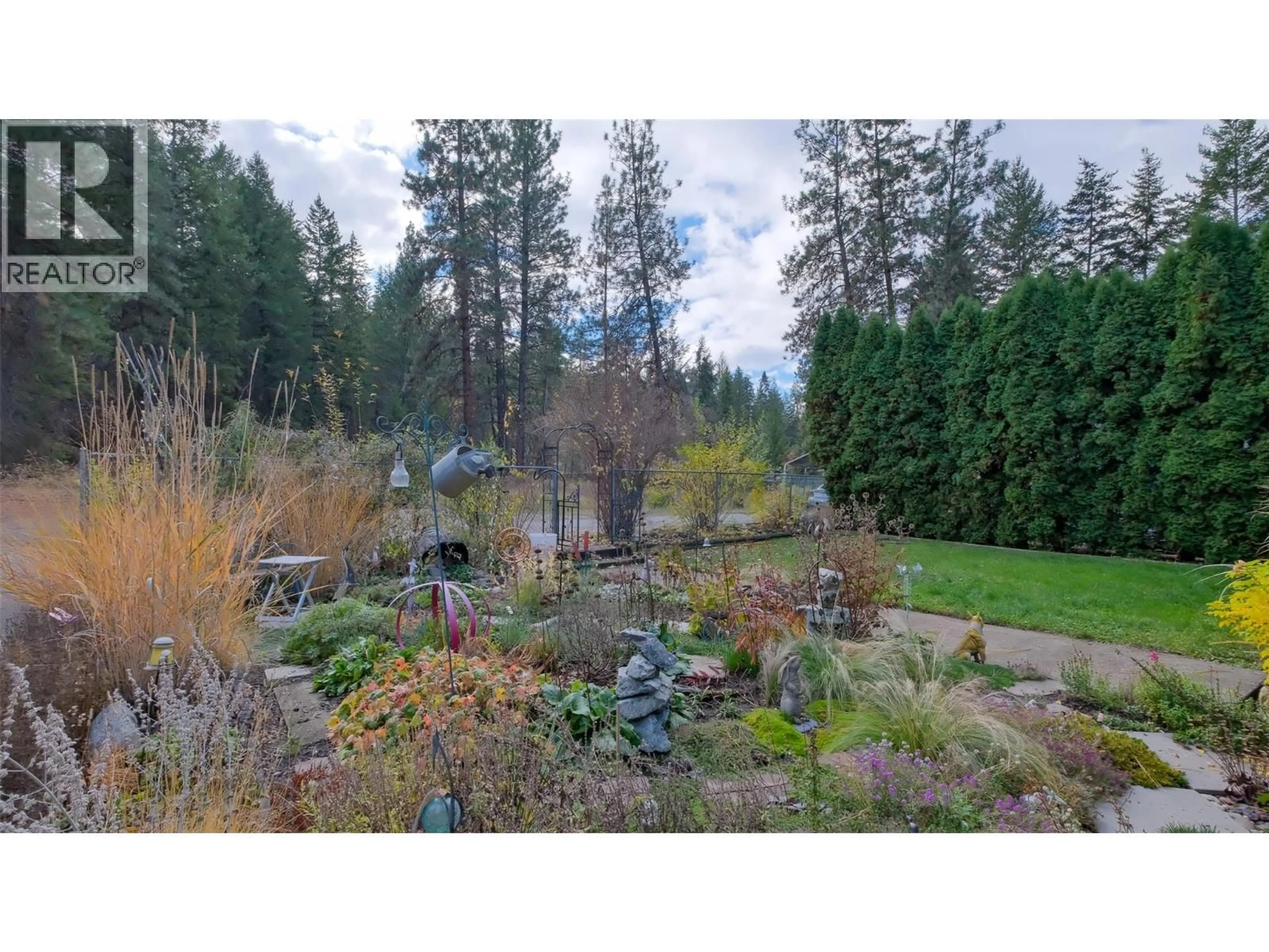 A pic from outside/outdoor area/front of a property/back of a property/a pic from drone, forest/trees view for 4099 MILLER ROAD, Kelowna British Columbia V1W4C7