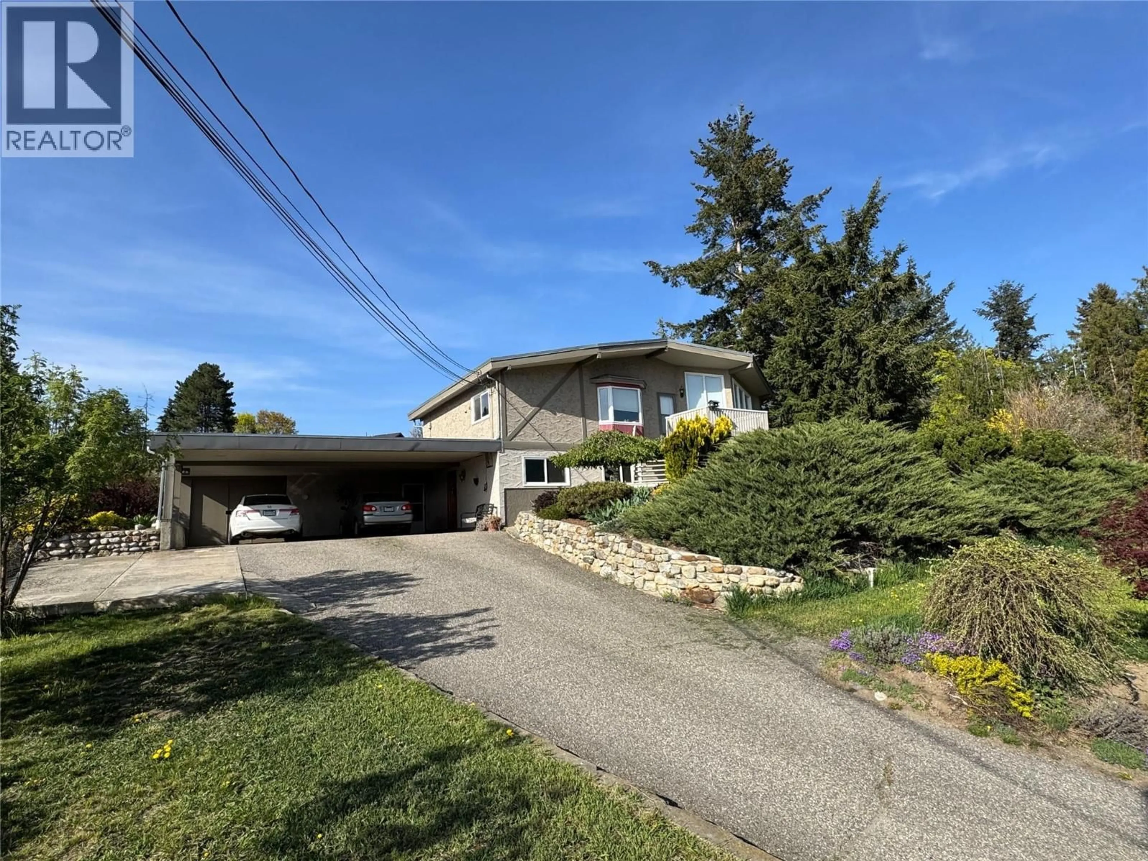A pic from outside/outdoor area/front of a property/back of a property/a pic from drone, street for 9713 VENABLES DRIVE, Coldstream British Columbia V1B2K1