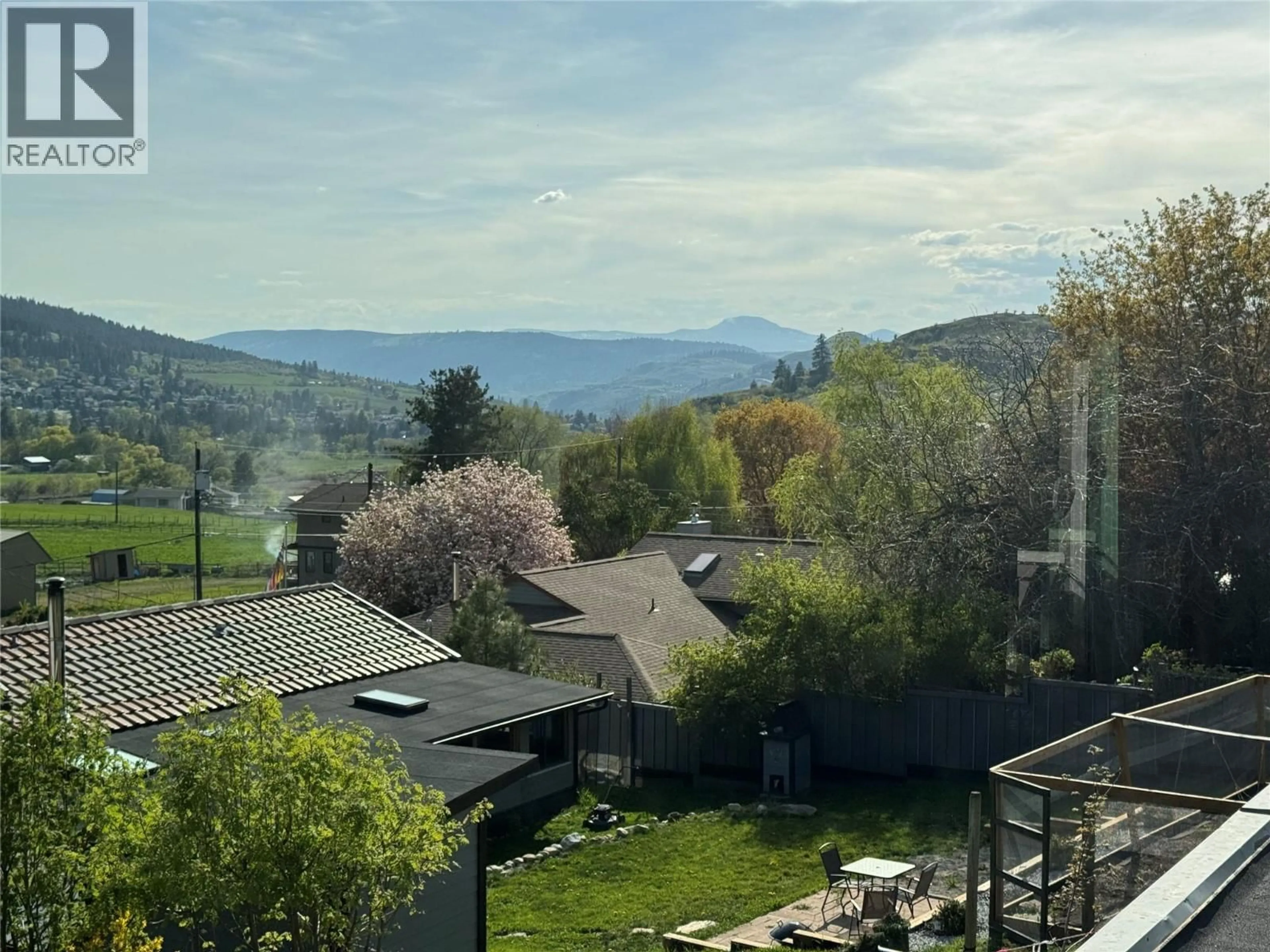 A pic from outside/outdoor area/front of a property/back of a property/a pic from drone, mountain view for 9713 VENABLES DRIVE, Coldstream British Columbia V1B2K1