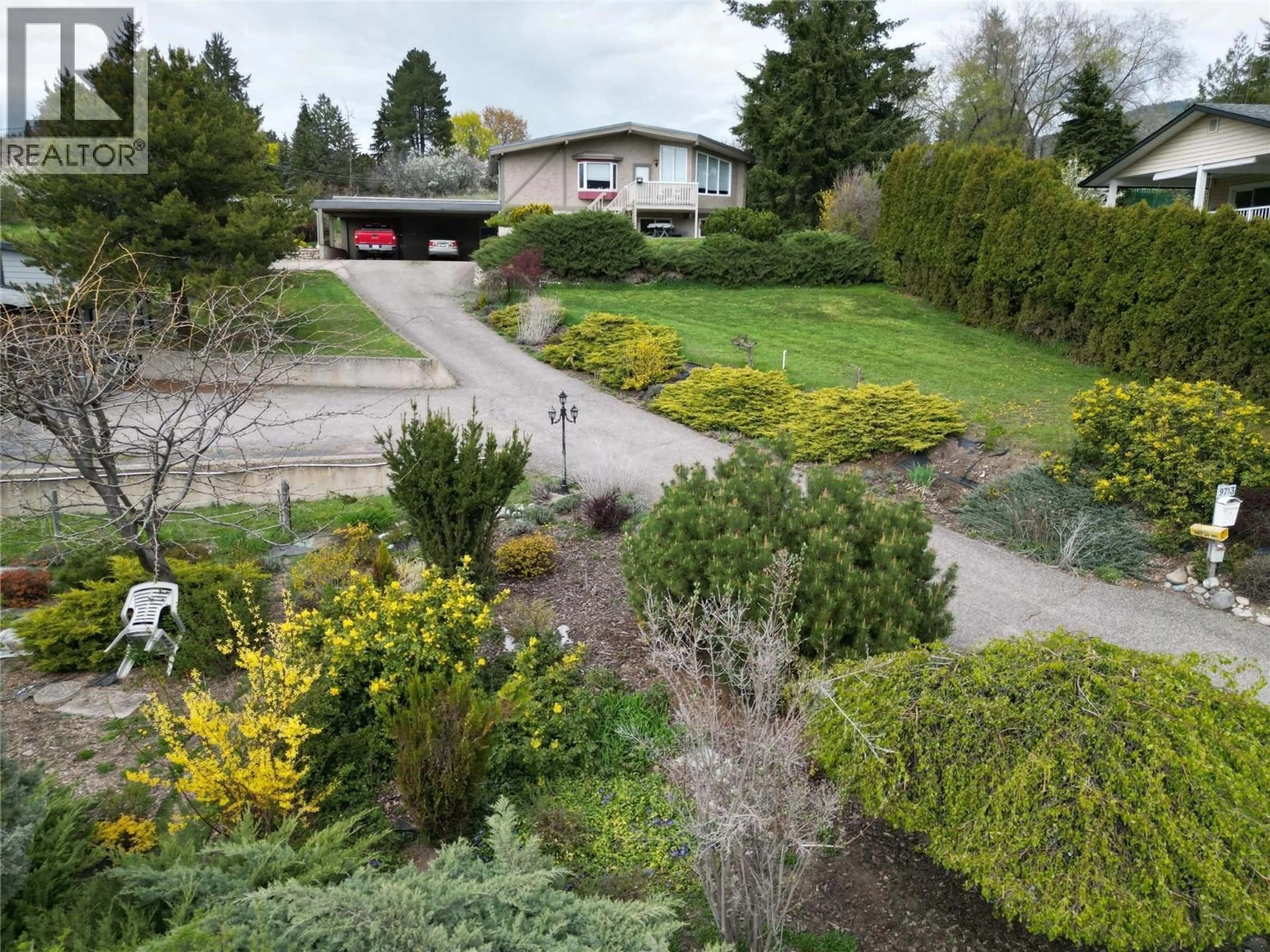 A pic from outside/outdoor area/front of a property/back of a property/a pic from drone, street for 9713 VENABLES DRIVE, Coldstream British Columbia V1B2K1