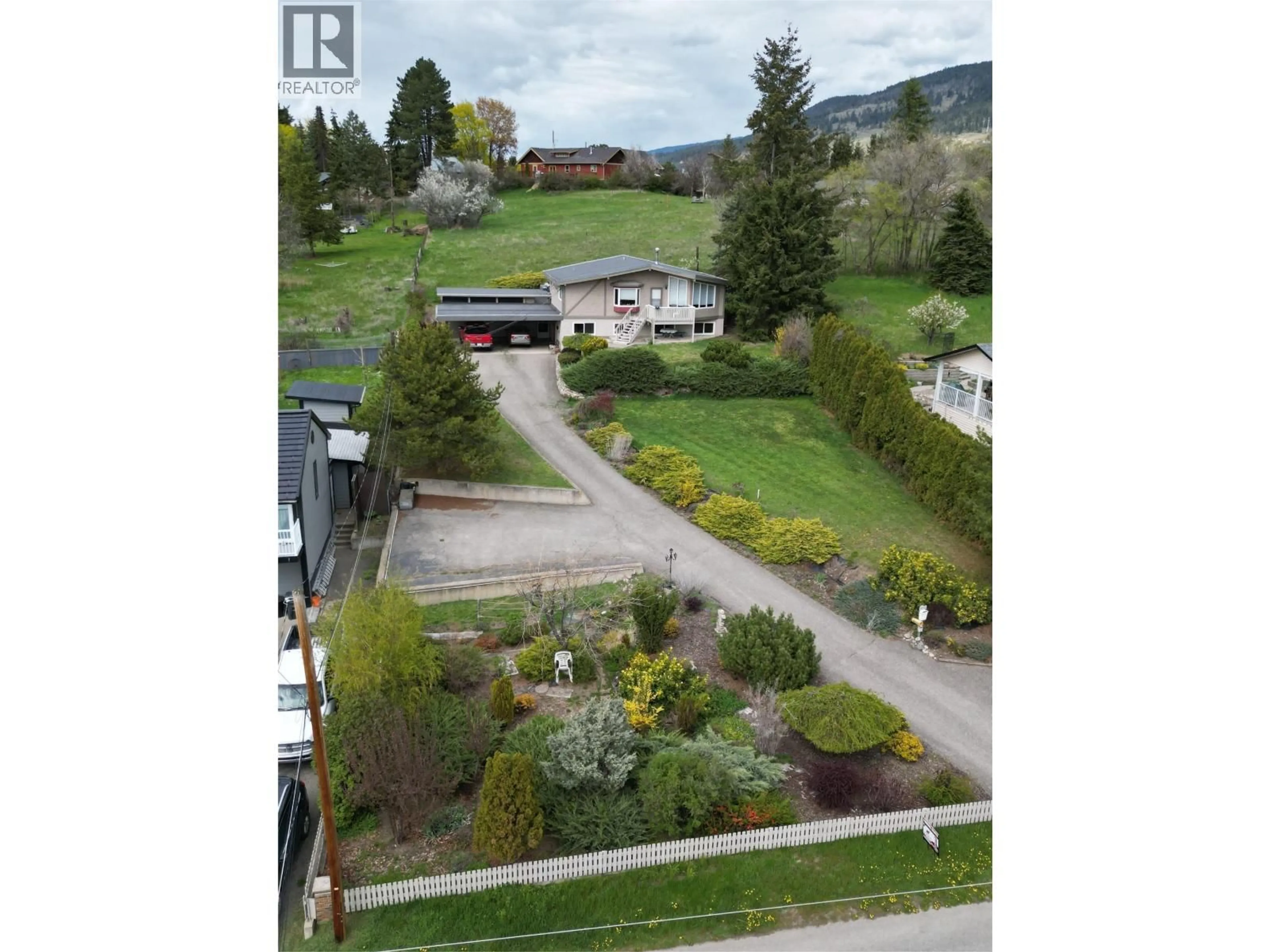 A pic from outside/outdoor area/front of a property/back of a property/a pic from drone, street for 9713 VENABLES DRIVE, Coldstream British Columbia V1B2K1