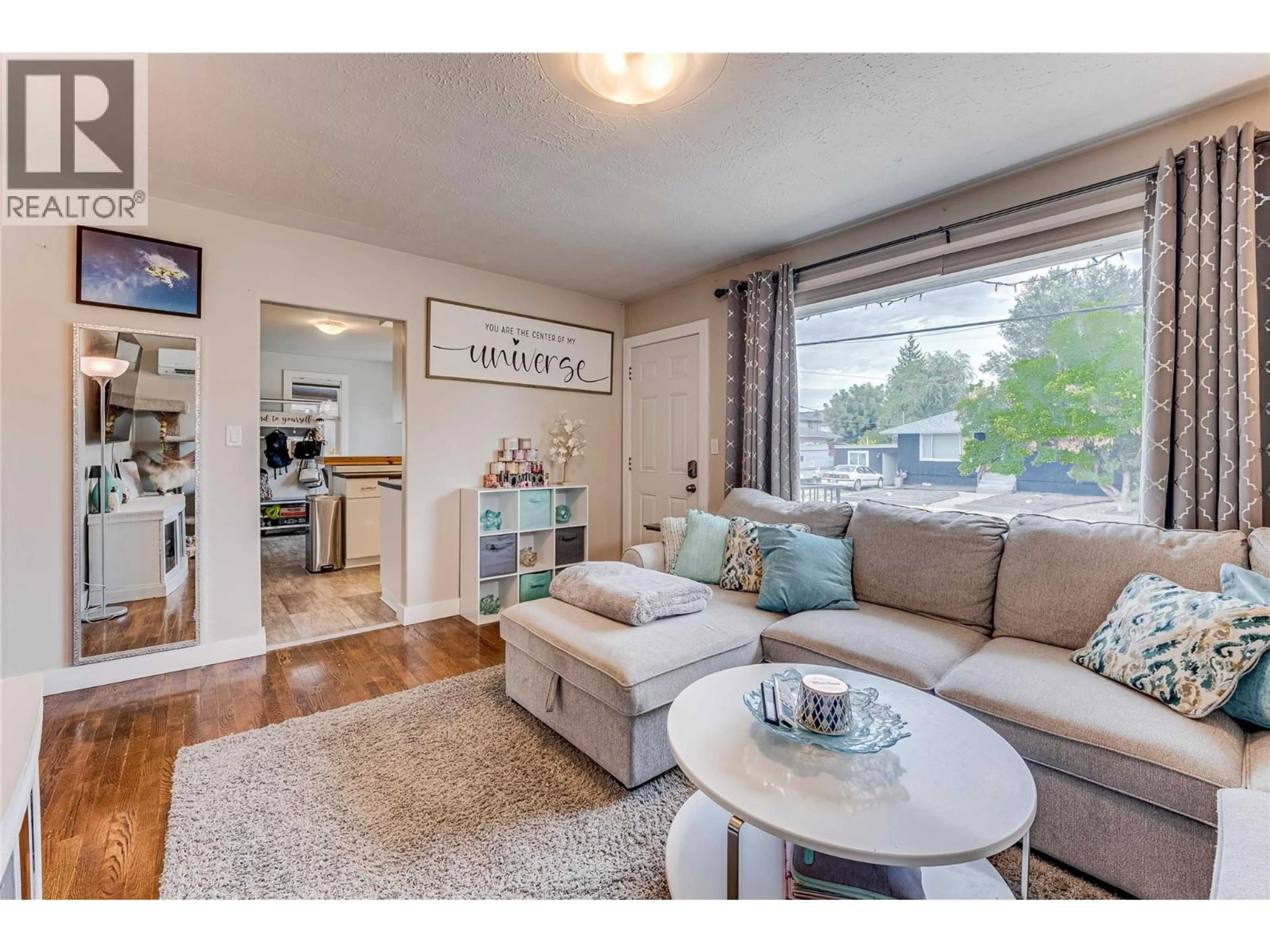 Living room with furniture, wood/laminate floor for 2302 42 AVENUE, Vernon British Columbia V1T3J3