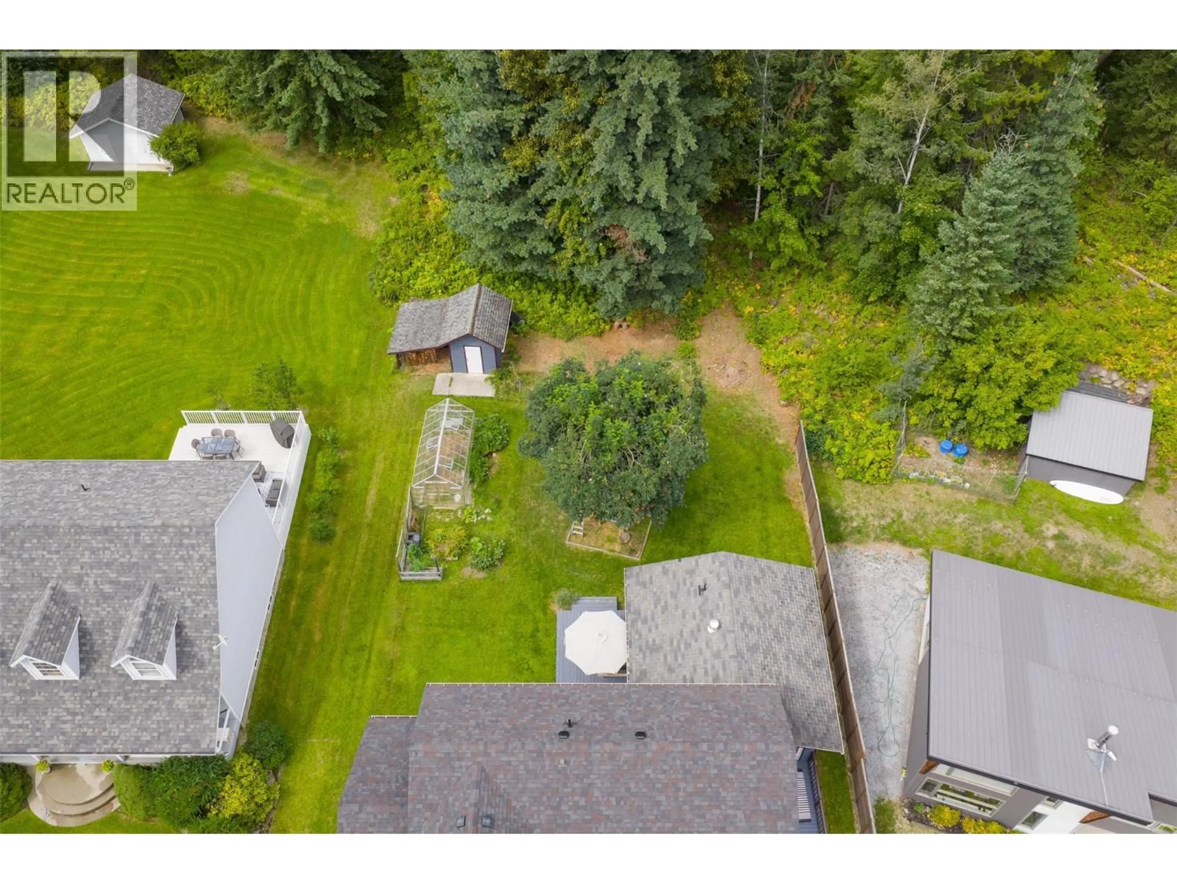 A pic from outside/outdoor area/front of a property/back of a property/a pic from drone, forest/trees view for 611 7TH STREET, Kaslo British Columbia V0G1M0