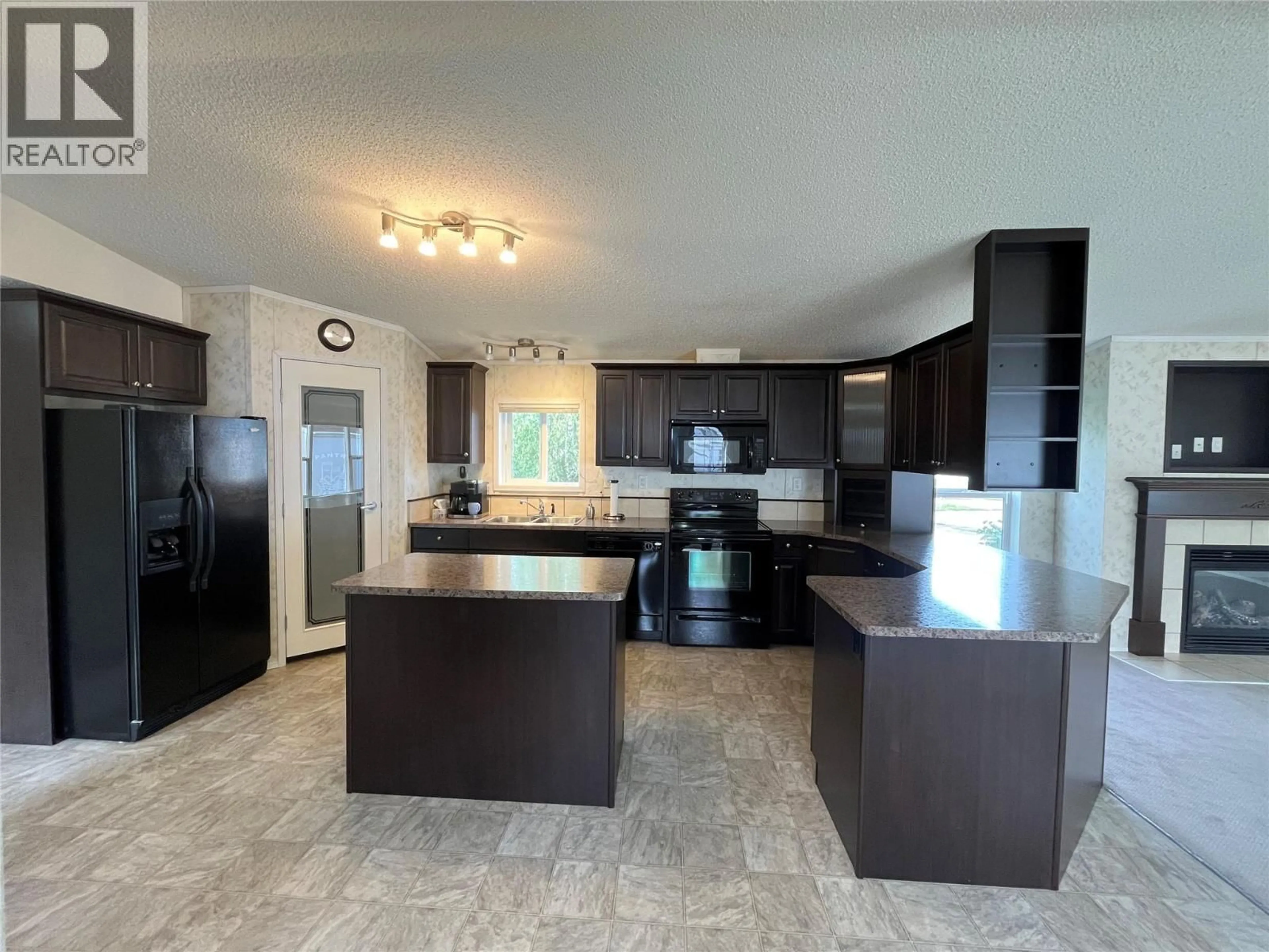 Open concept kitchen, ceramic/tile floor for 136 ROCKCLIFFE PLACE, Tumbler Ridge British Columbia V0C2W0