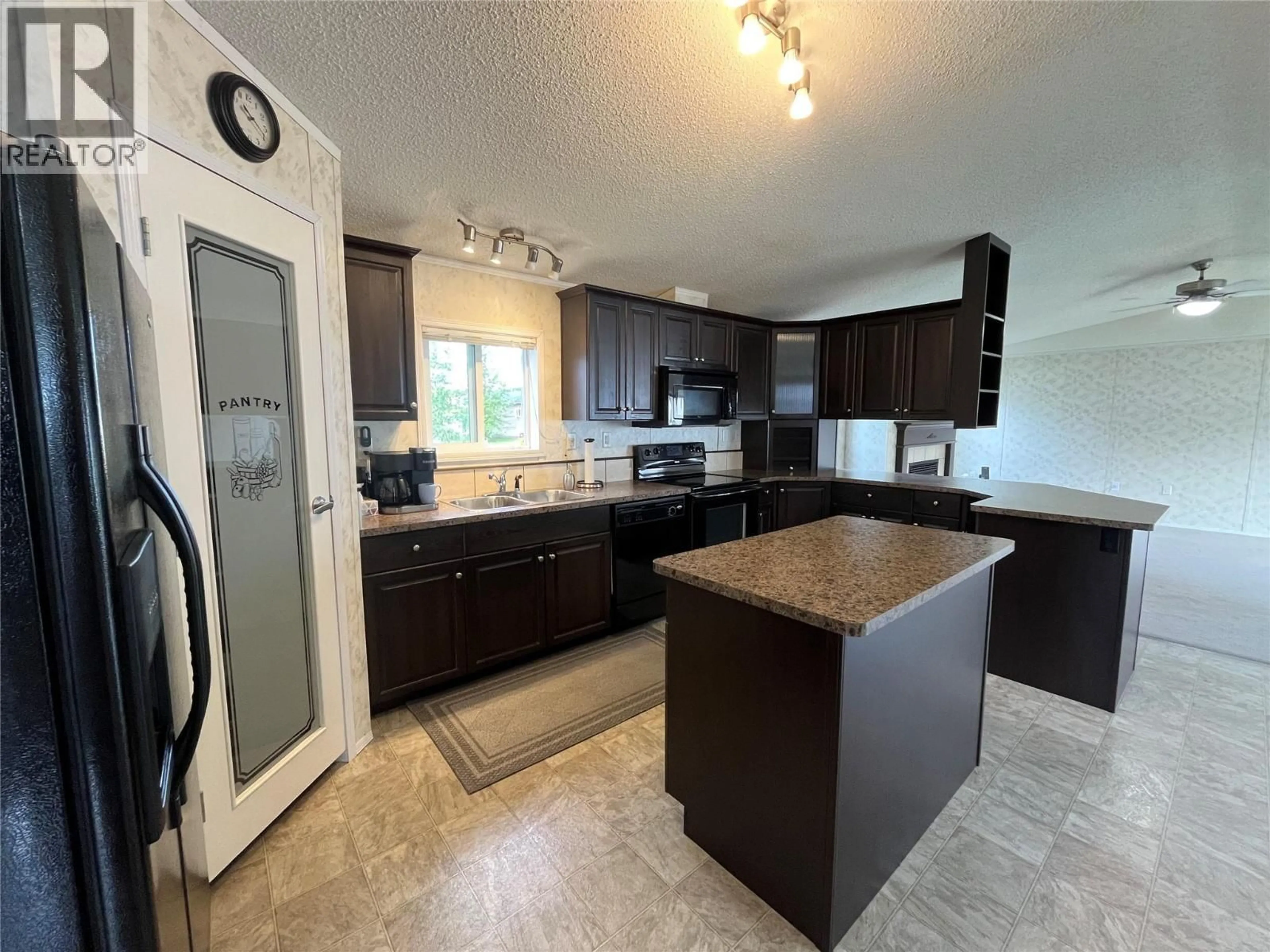 Open concept kitchen, unknown for 136 ROCKCLIFFE PLACE, Tumbler Ridge British Columbia V0C2W0