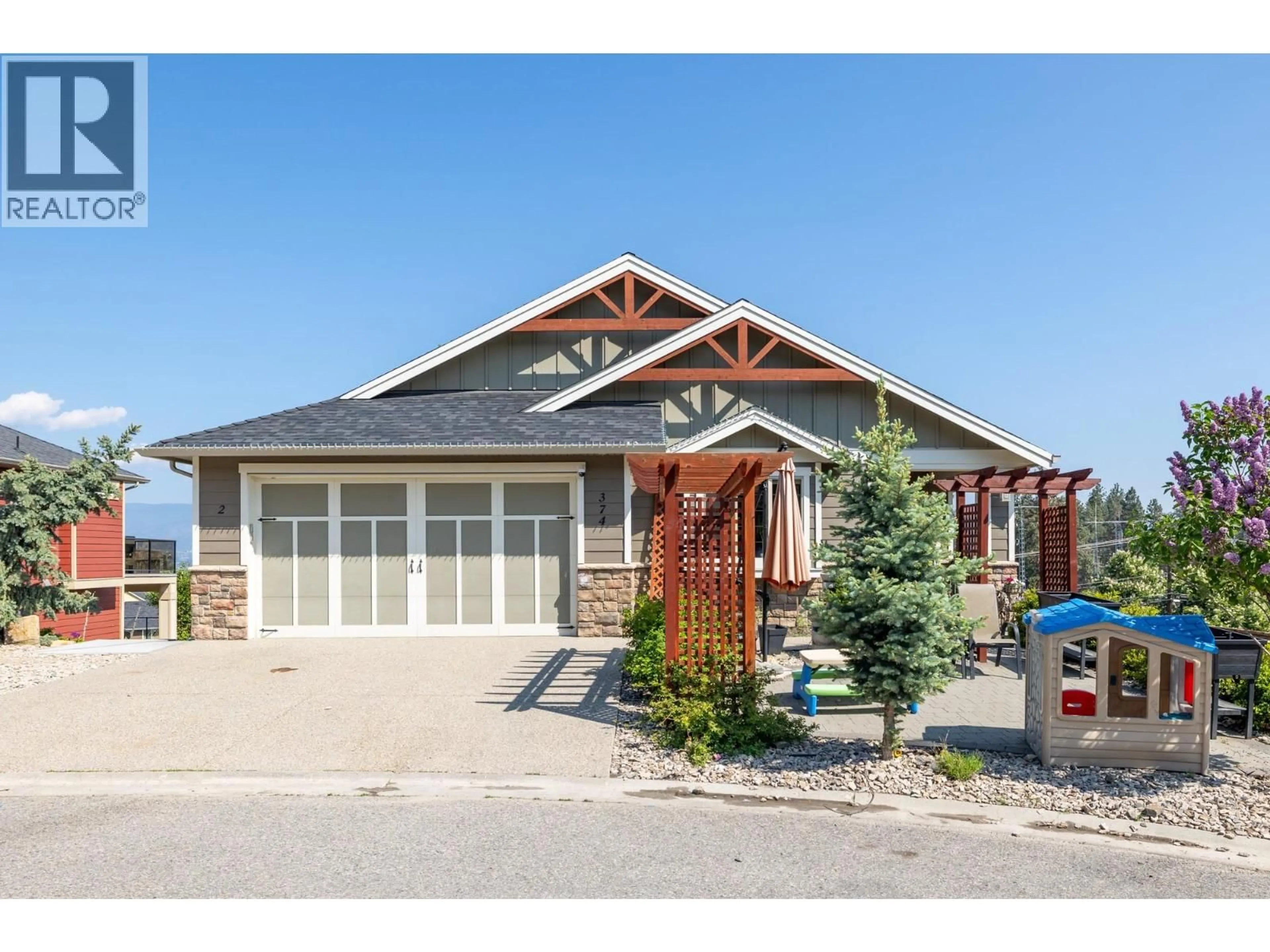 Home with vinyl exterior material, street for 374 TRUMPETER COURT, Kelowna British Columbia V1W5J4