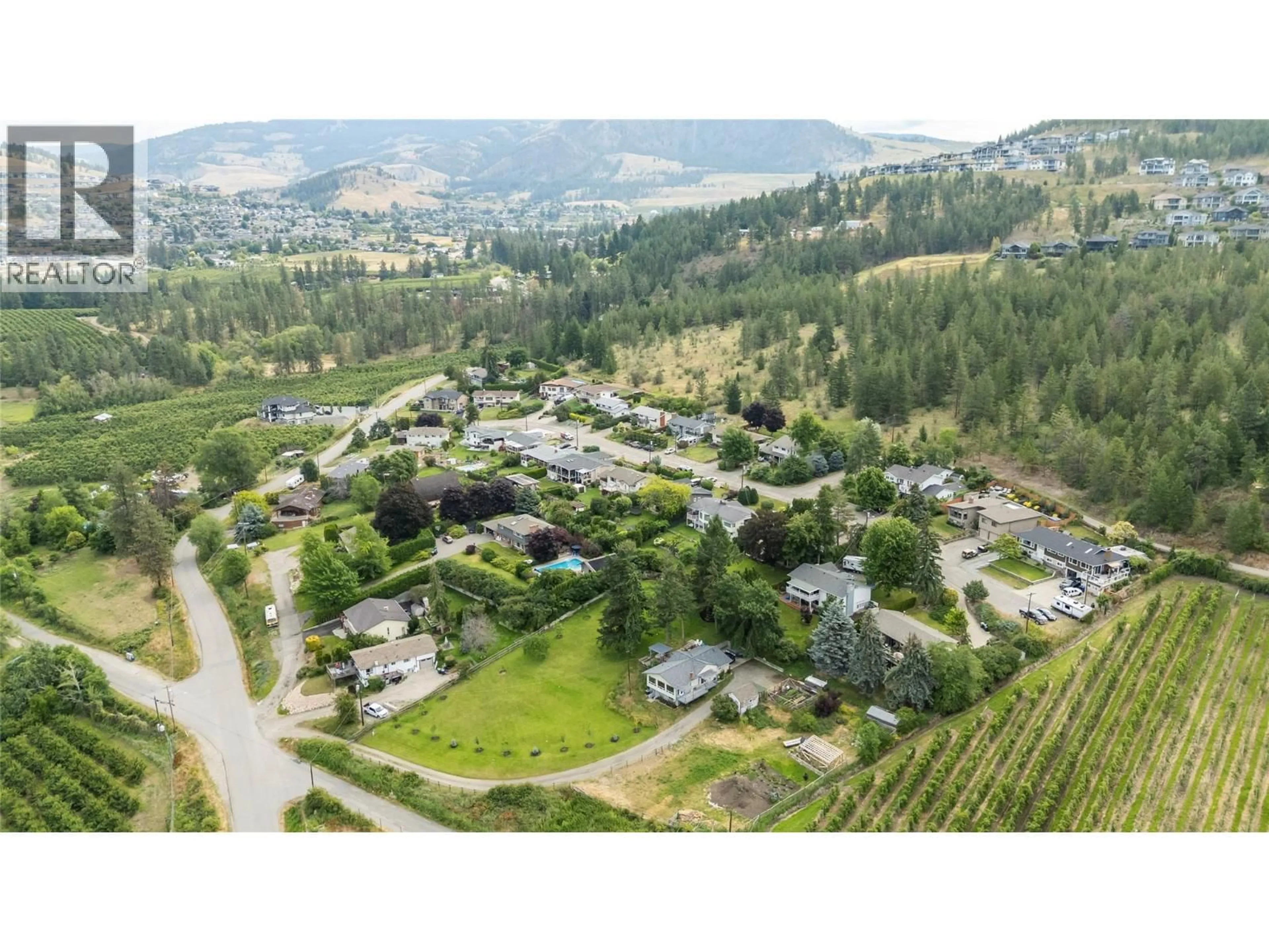 A pic from outside/outdoor area/front of a property/back of a property/a pic from drone, mountain view for 2300 CHARLESWOOD DRIVE, Kelowna British Columbia V1P1E4
