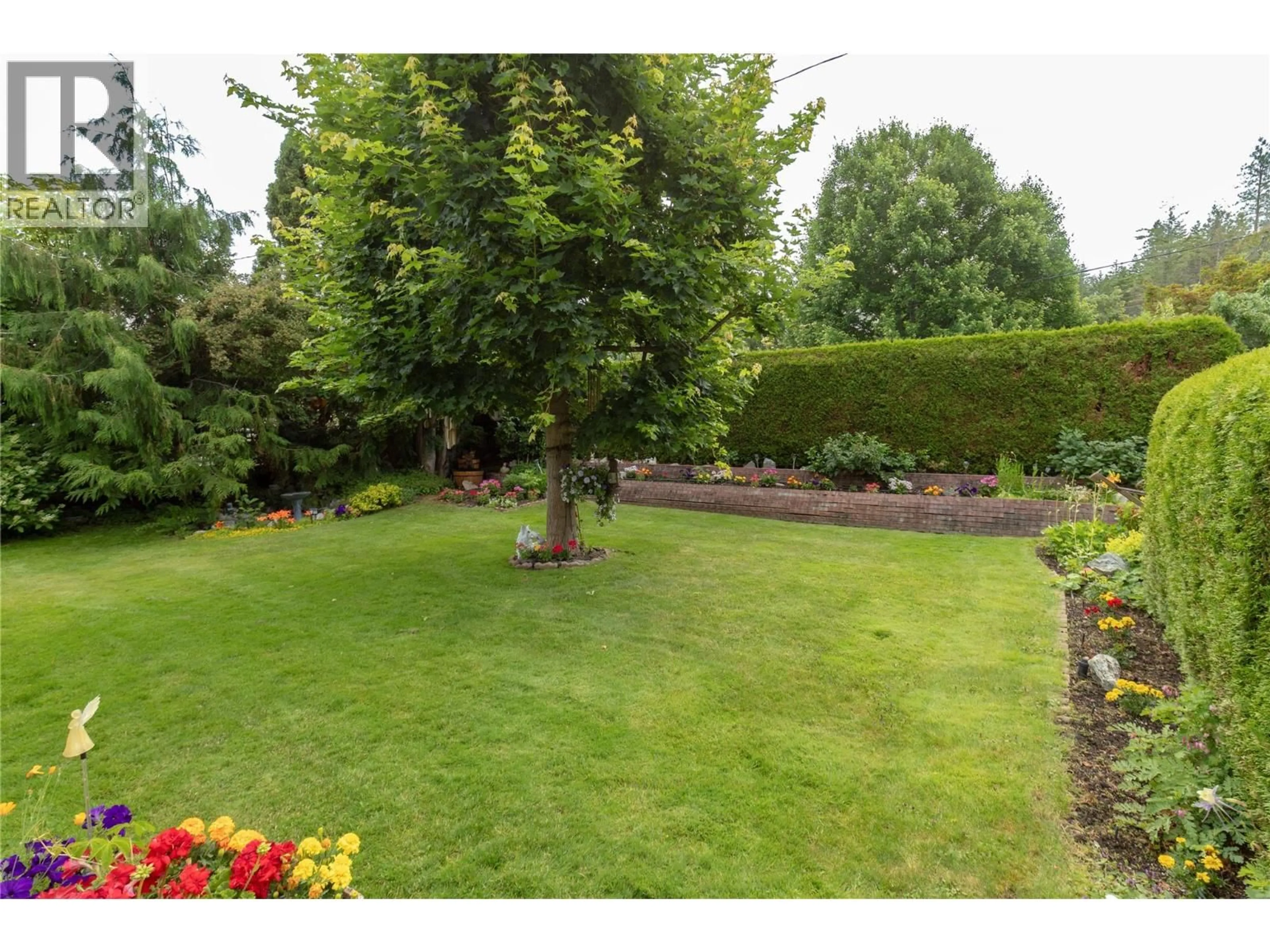 A pic from outside/outdoor area/front of a property/back of a property/a pic from drone, forest/trees view for 2300 CHARLESWOOD DRIVE, Kelowna British Columbia V1P1E4