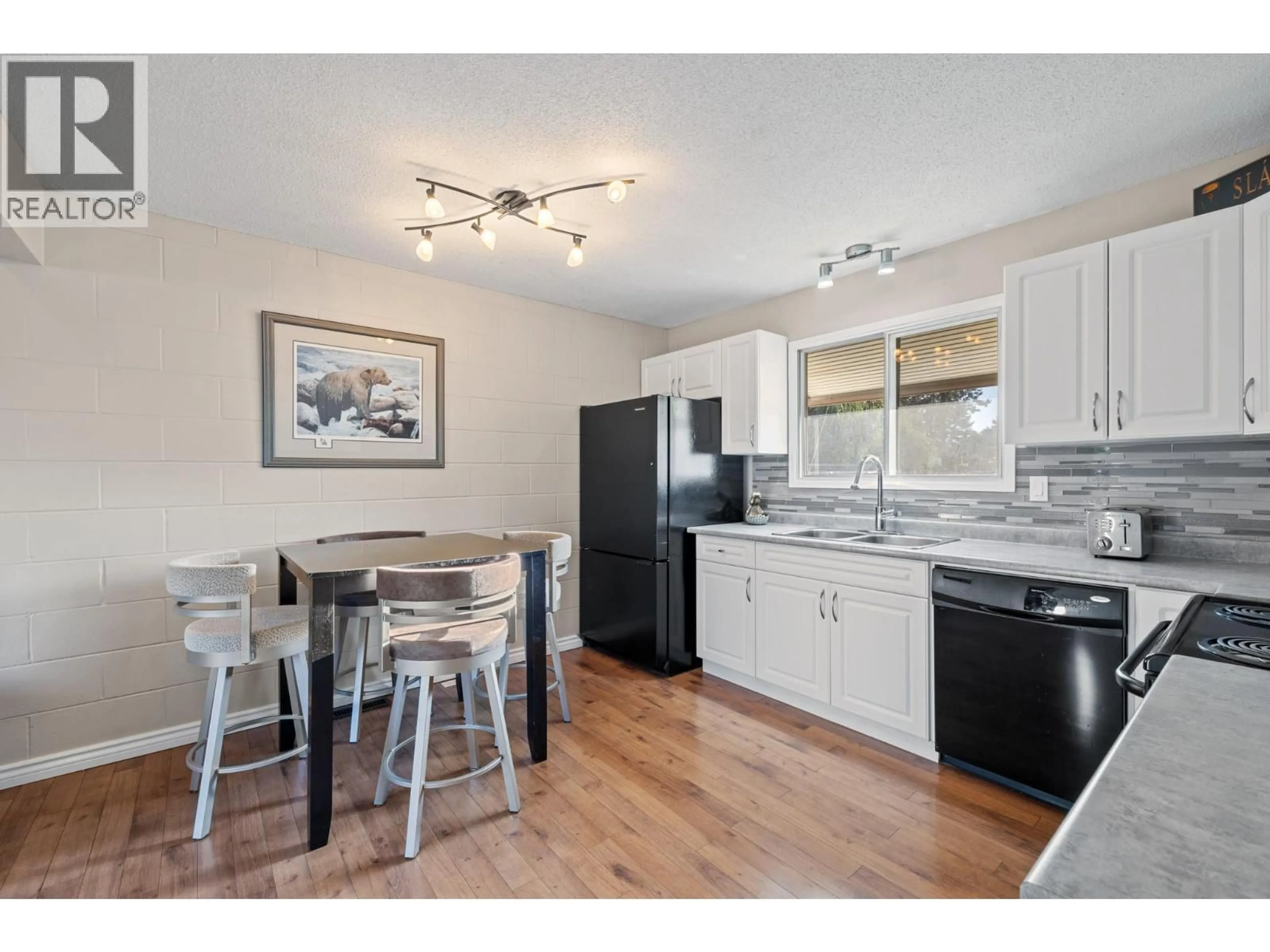 Open concept kitchen, wood/laminate floor for 1040 GLENMORE DRIVE, Kelowna British Columbia V1Y4P2