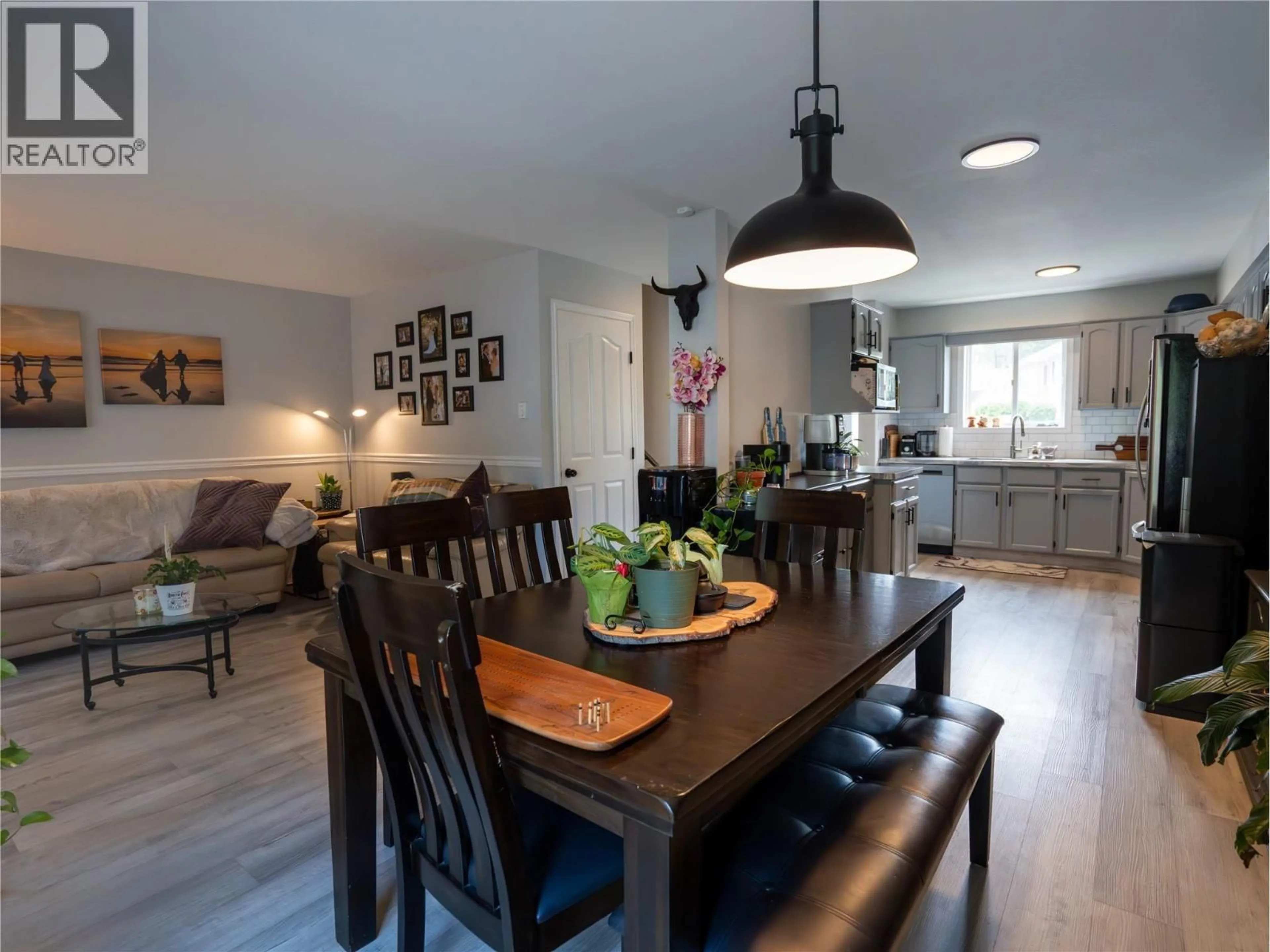 Open concept kitchen, wood/laminate floor for 107 - 1458 PENTICTON AVENUE, Penticton British Columbia V2A8l3