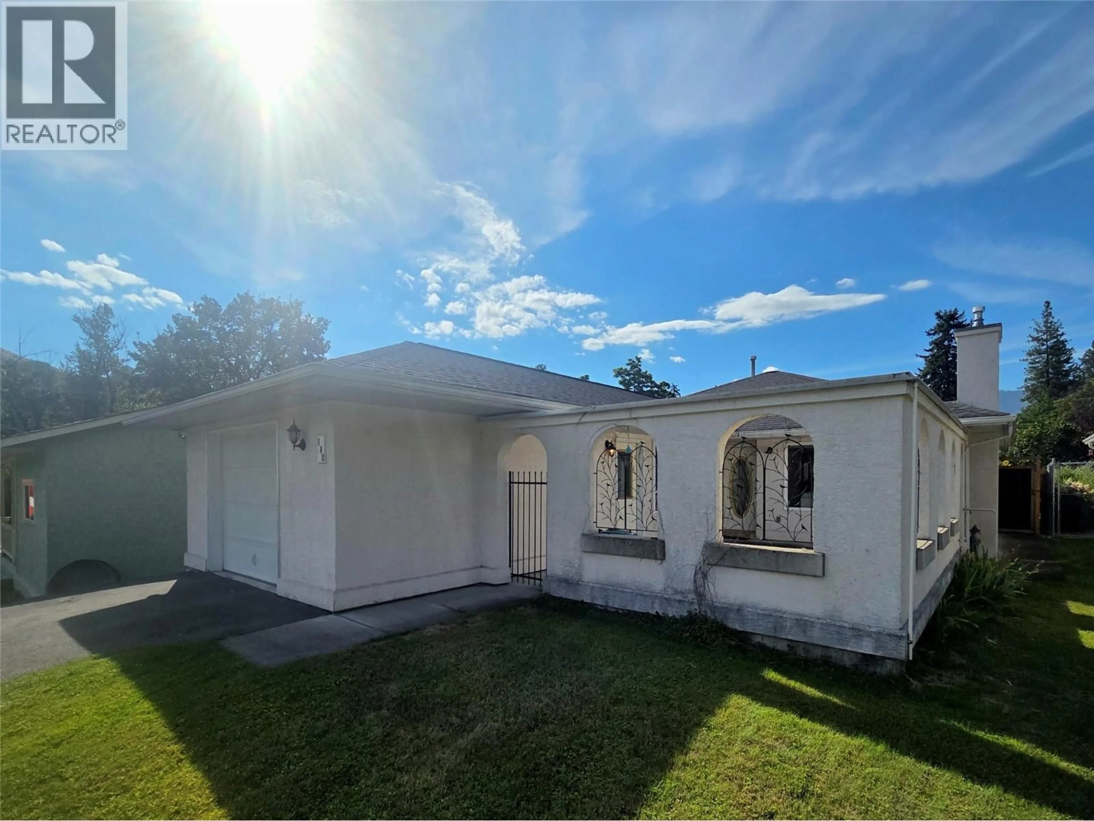 Home with vinyl exterior material, street for 140 78TH AVENUE, Grand Forks British Columbia V0H1H0