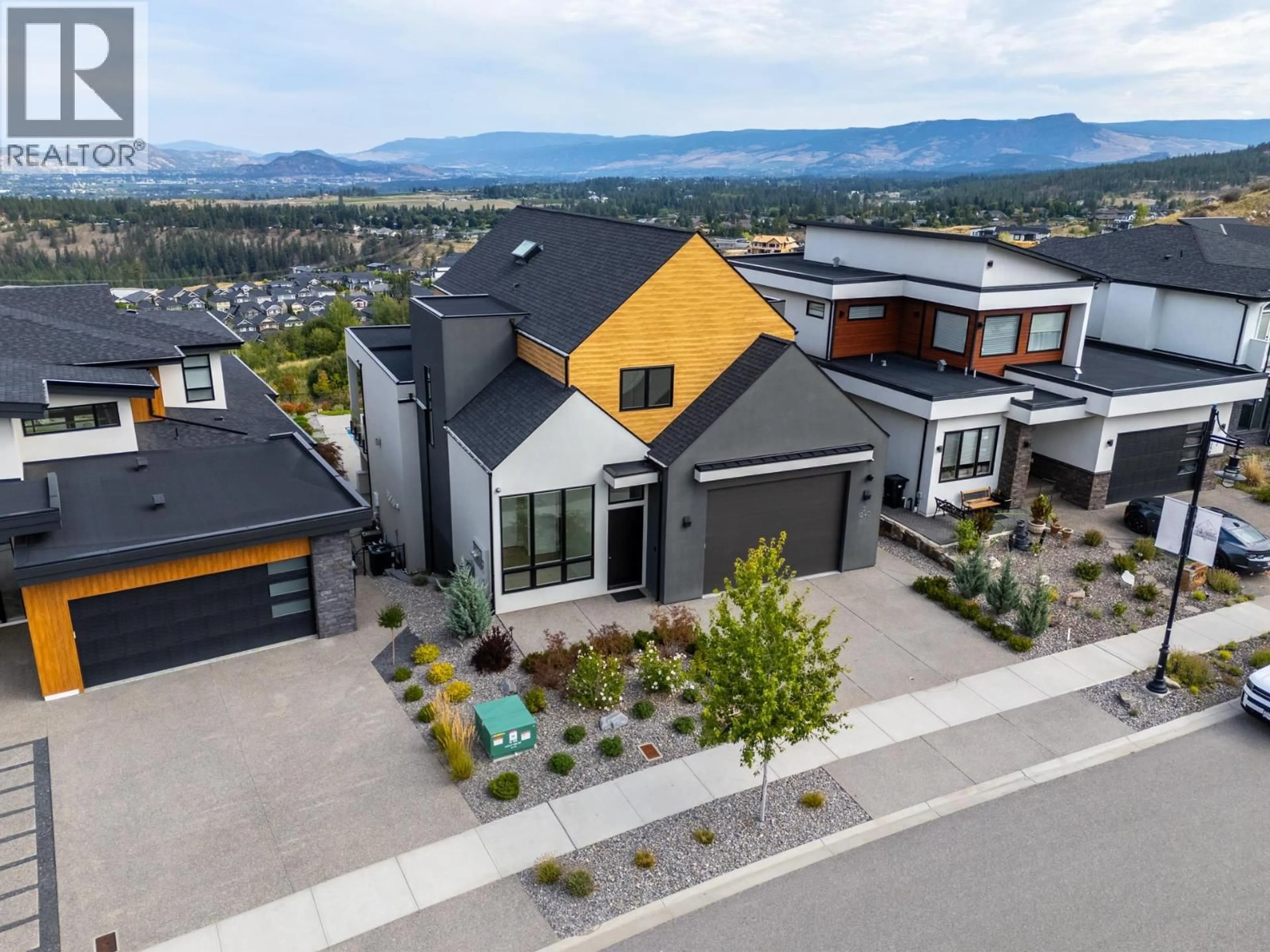A pic from outside/outdoor area/front of a property/back of a property/a pic from drone, mountain view for 1240 PONDS AVENUE, Kelowna British Columbia V1W5N1