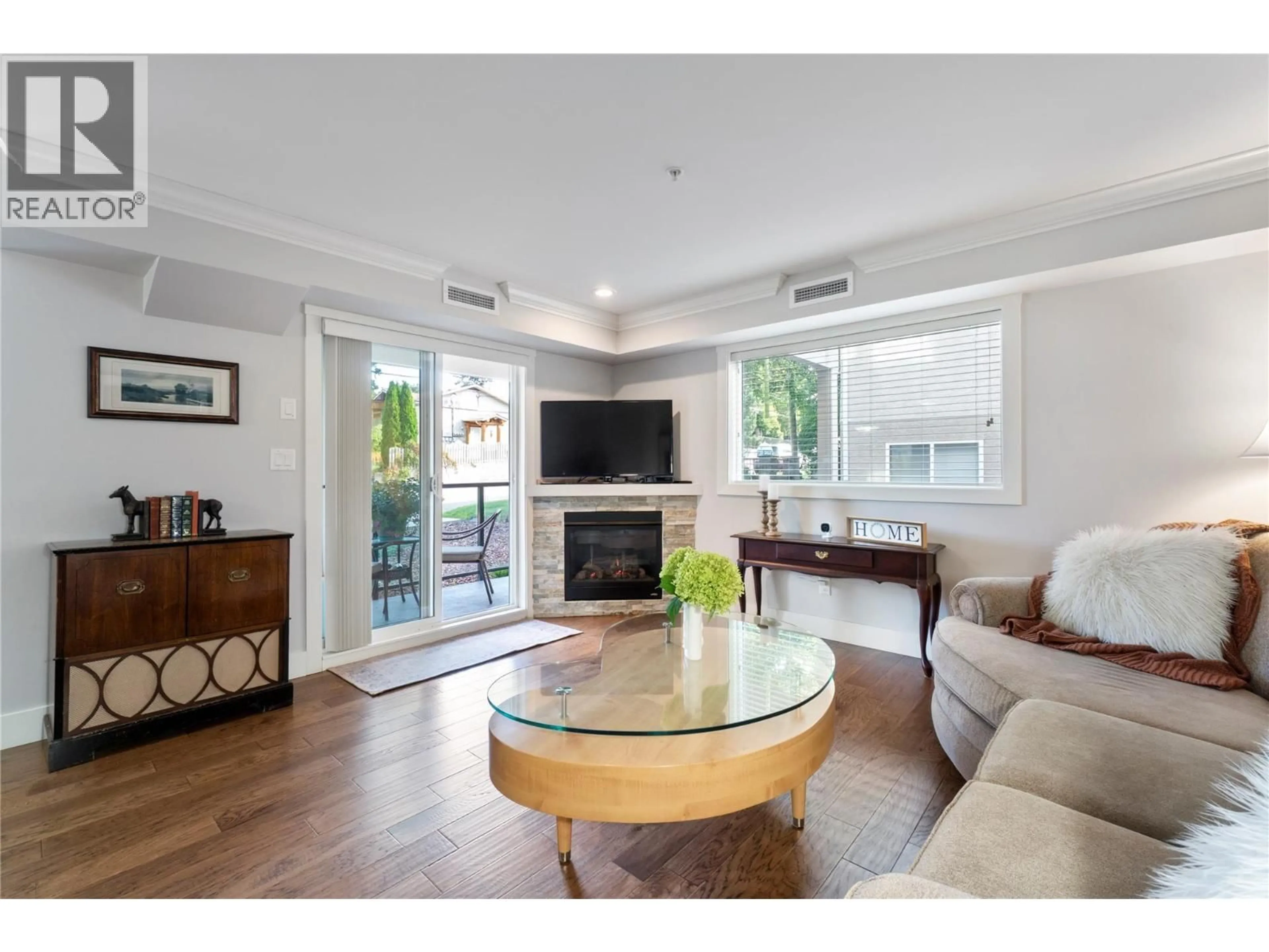 Living room with furniture, wood/laminate floor for 202 - 330 4TH AVENUE SOUTHEAST, Salmon Arm British Columbia V1E0E2