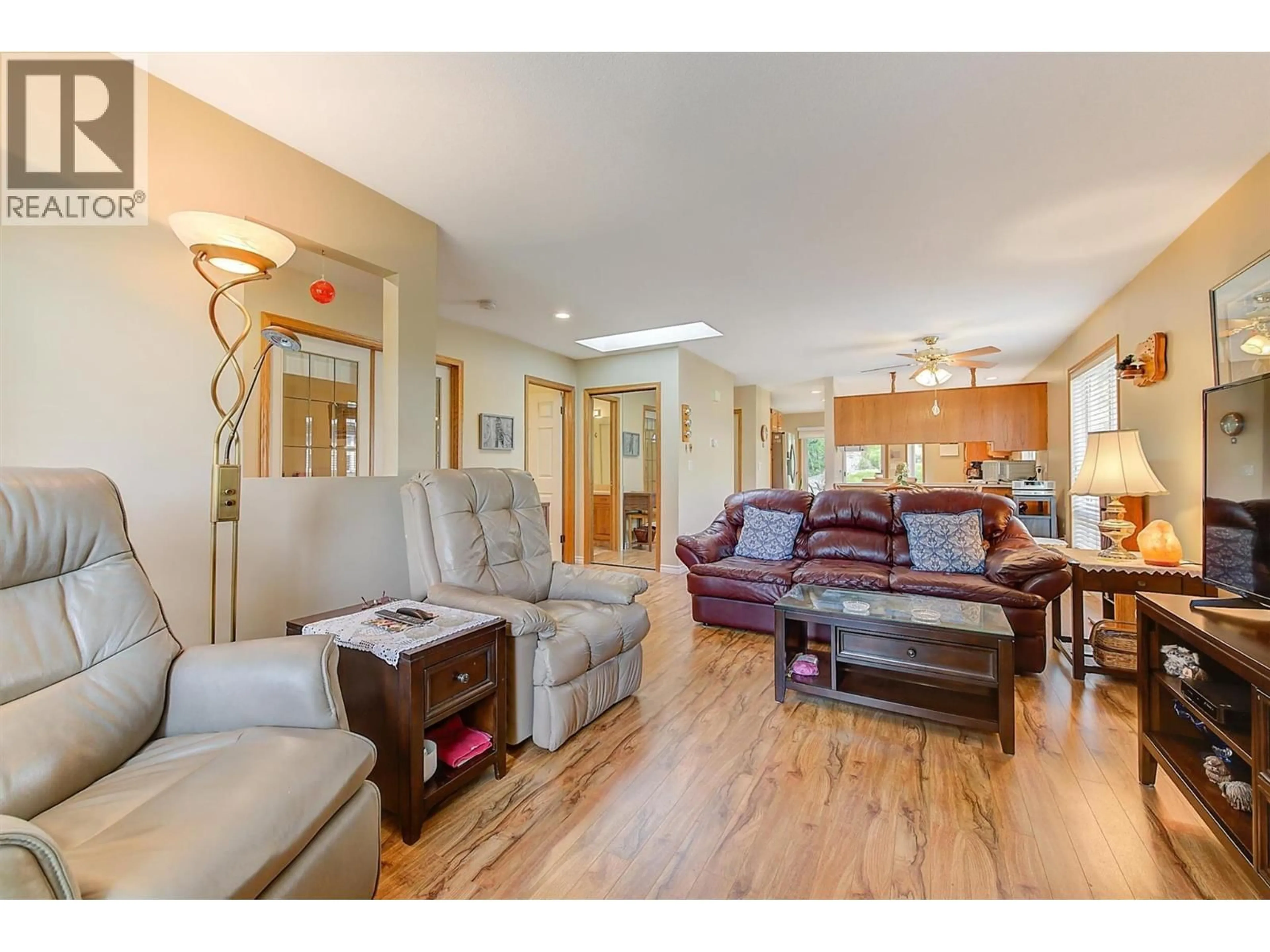 Living room with furniture, wood/laminate floor for 125 - 4035 GELLATLY ROAD SOUTH, West Kelowna British Columbia V4T1R7