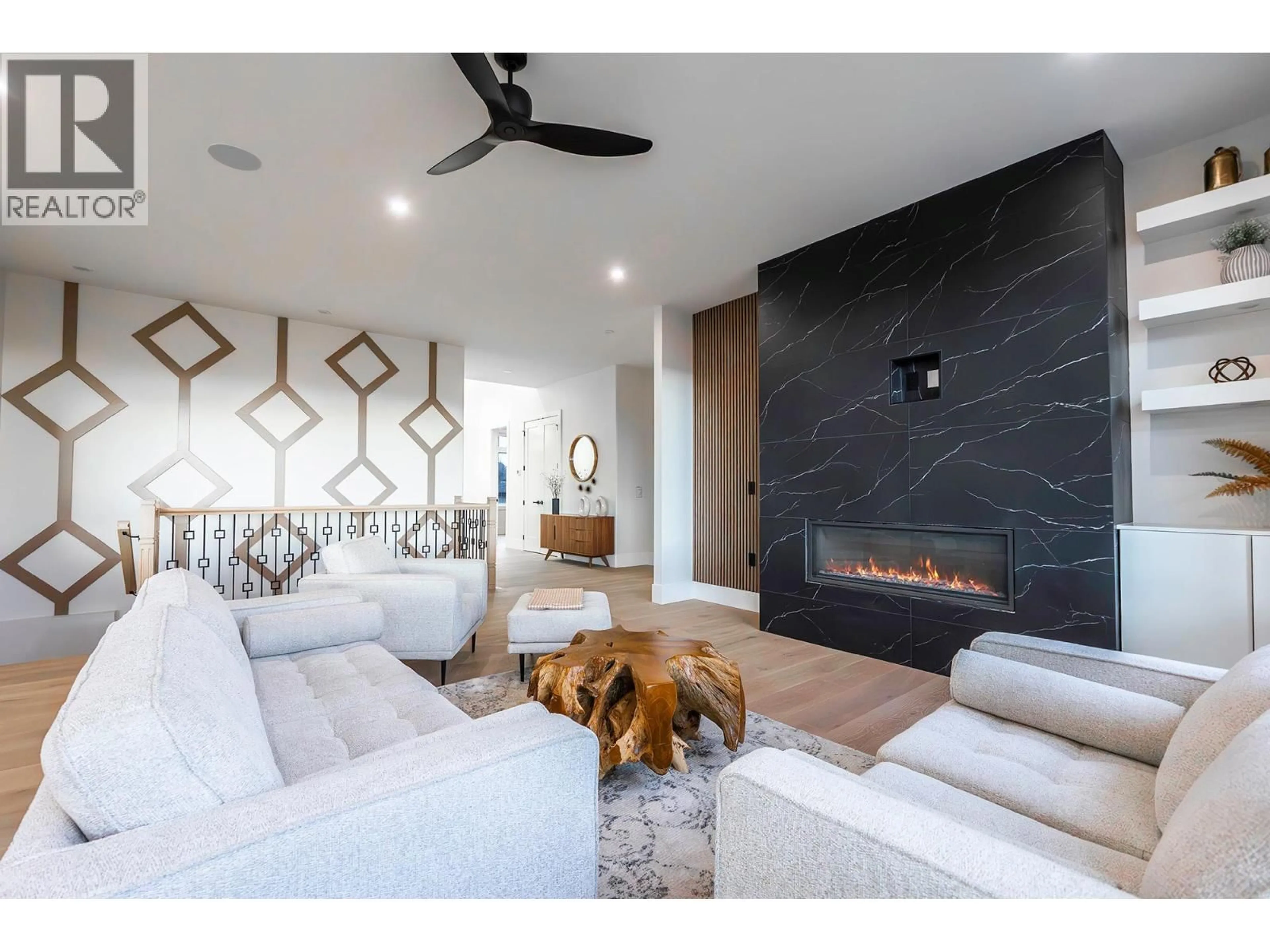 Living room with furniture, ceramic/tile floor for 718 CARNOUSTIE DRIVE, Kelowna British Columbia V1P1V2