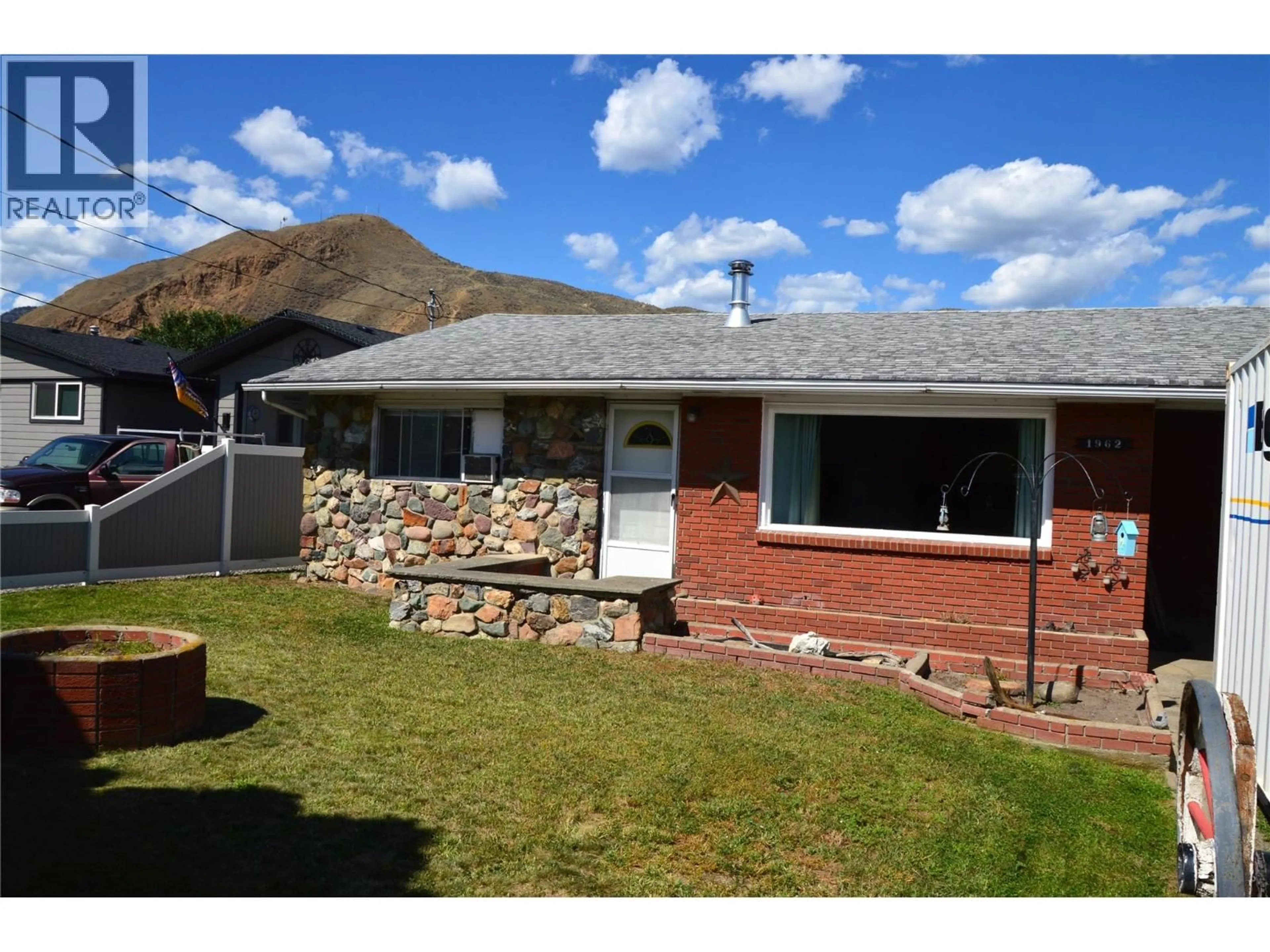 A pic from outside/outdoor area/front of a property/back of a property/a pic from drone, mountain view for 1962 PARKCREST AVENUE, Kamloops British Columbia V2B4X4