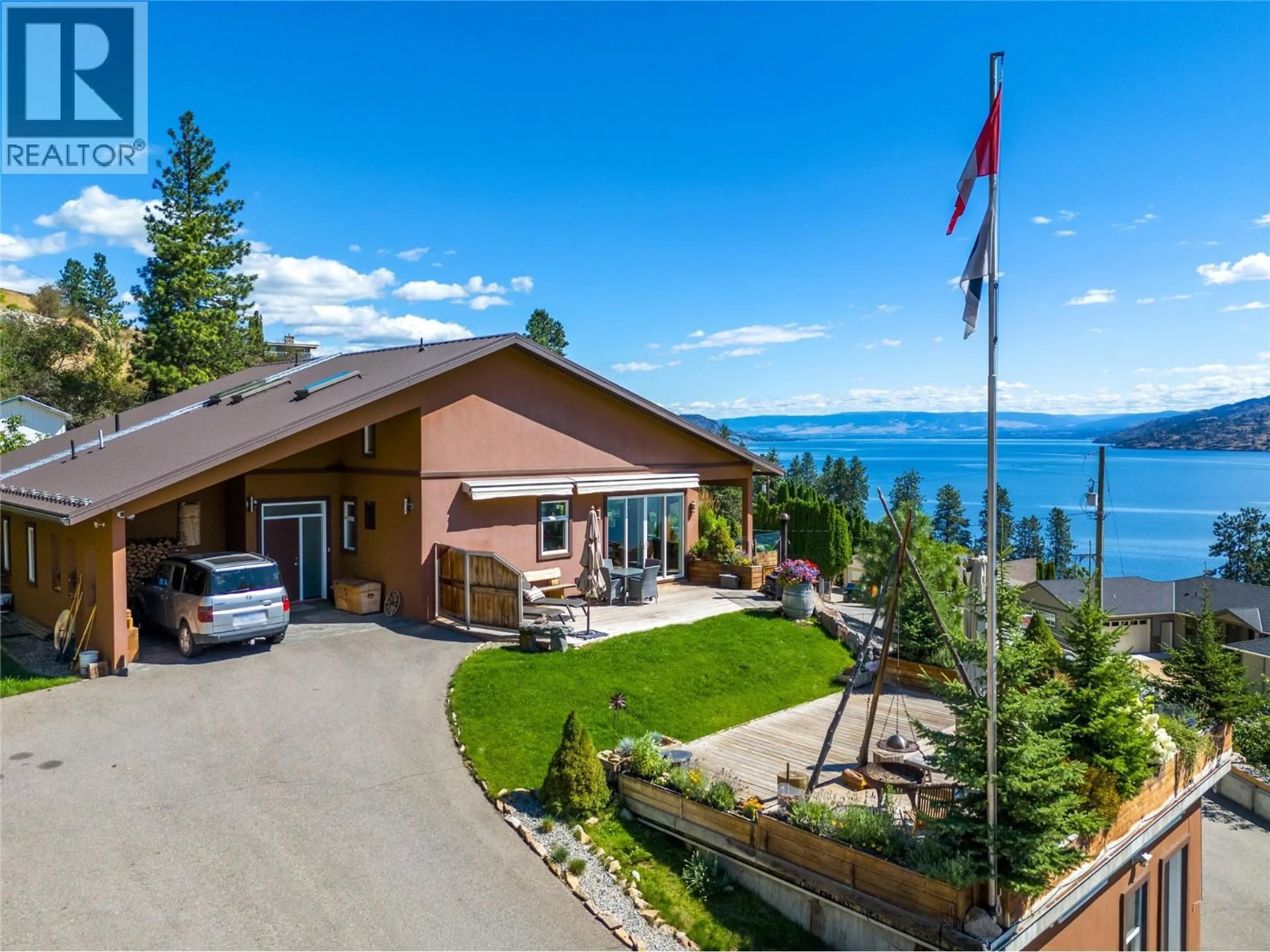 A pic from outside/outdoor area/front of a property/back of a property/a pic from drone, water/lake/river/ocean view for 6376 TOPHAM PLACE, Peachland British Columbia V0H1X7