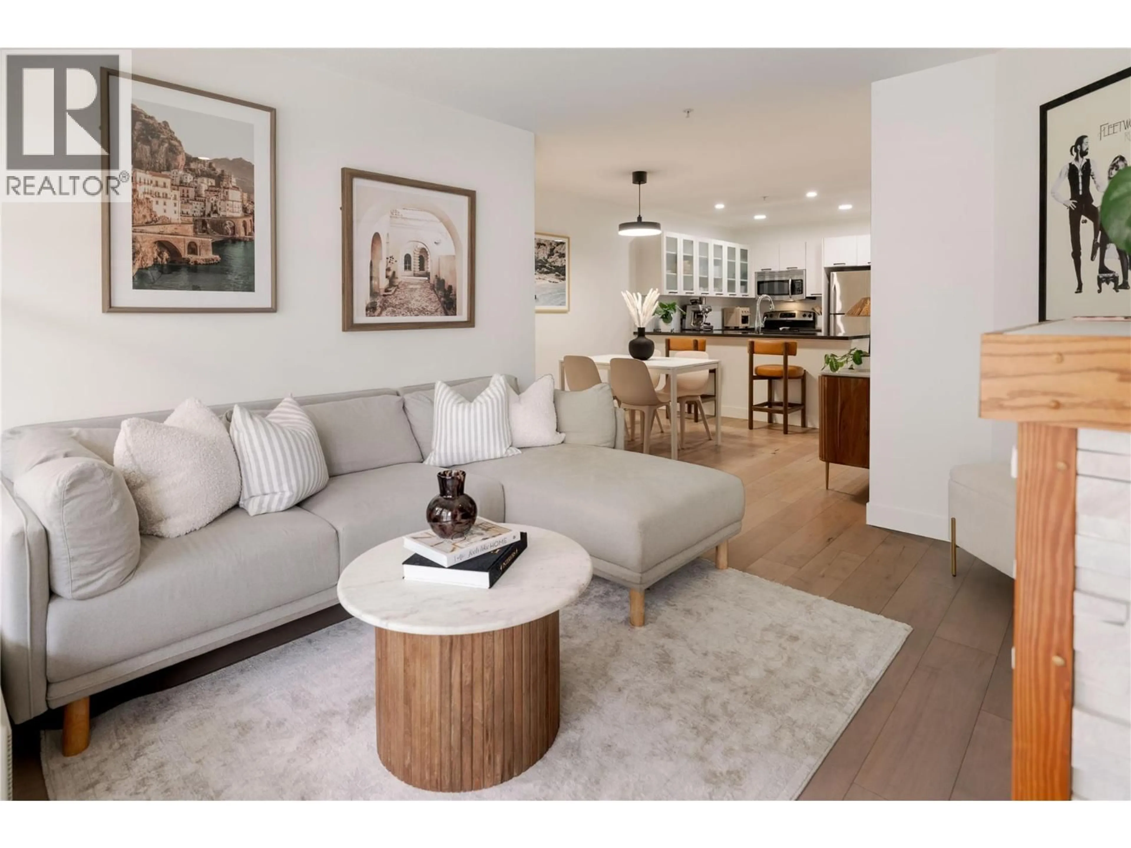 Living room with furniture, wood/laminate floor for 105 - 539 YATES ROAD, Kelowna British Columbia V1V2T8