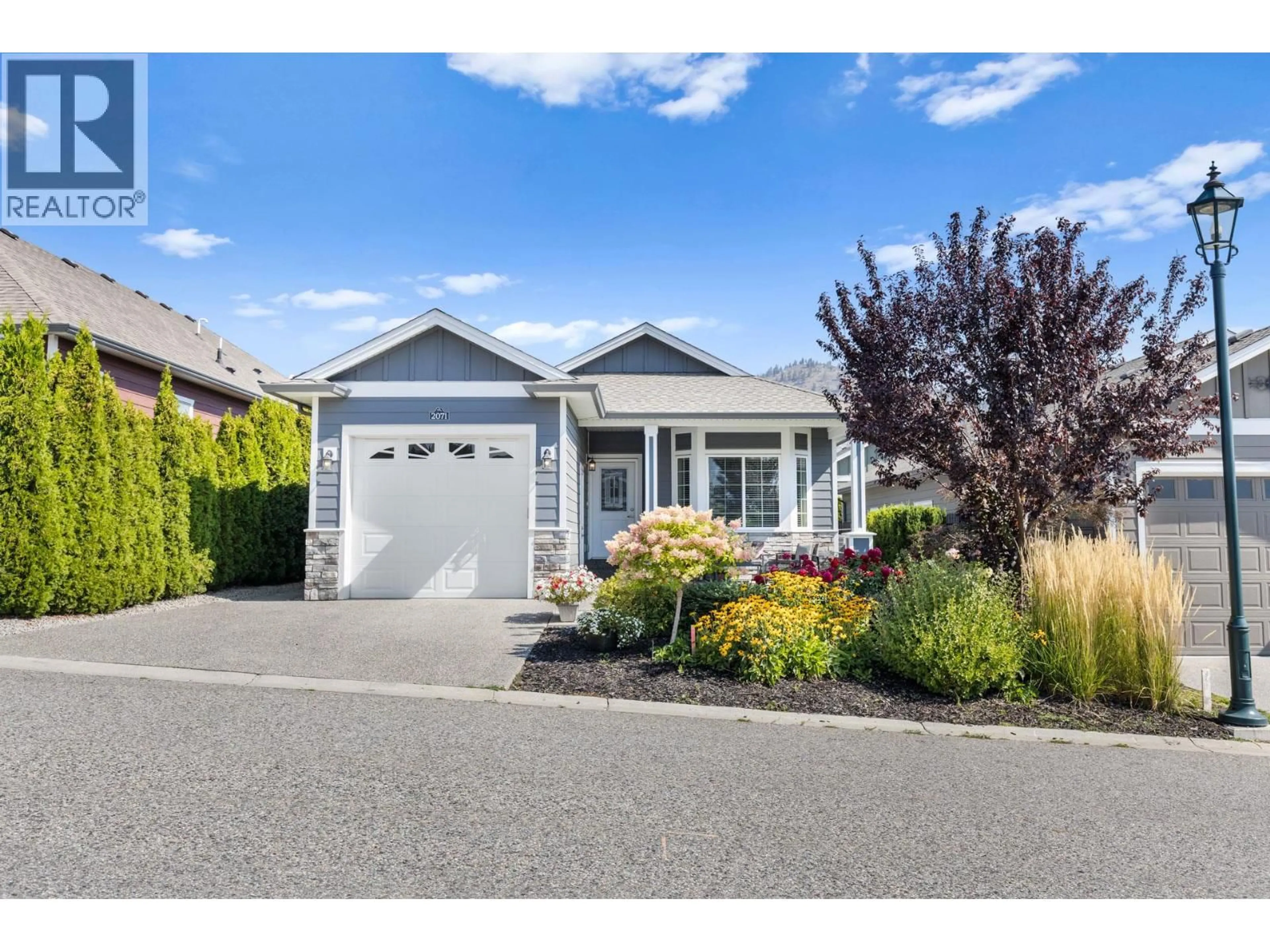 Home with vinyl exterior material, street for 2071 MALLARD DRIVE, Westbank British Columbia V4T3A5