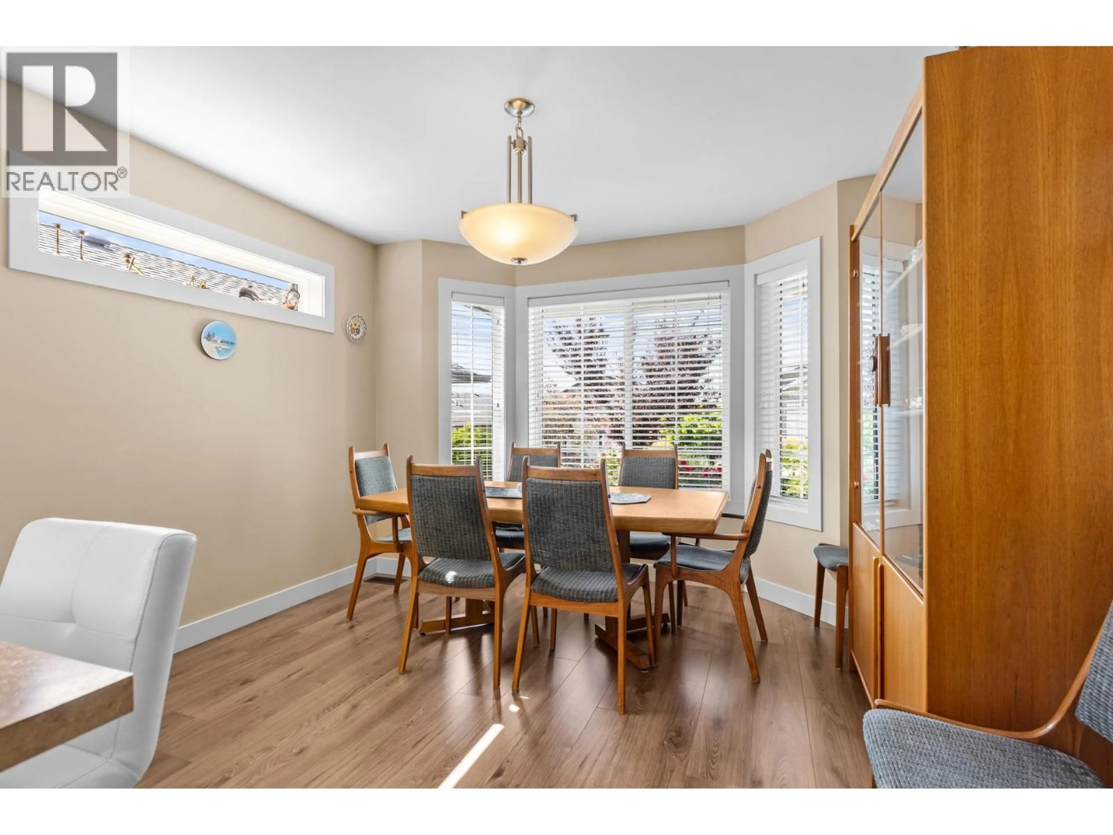 Dining room, wood/laminate floor for 2071 MALLARD DRIVE, Westbank British Columbia V4T3A5