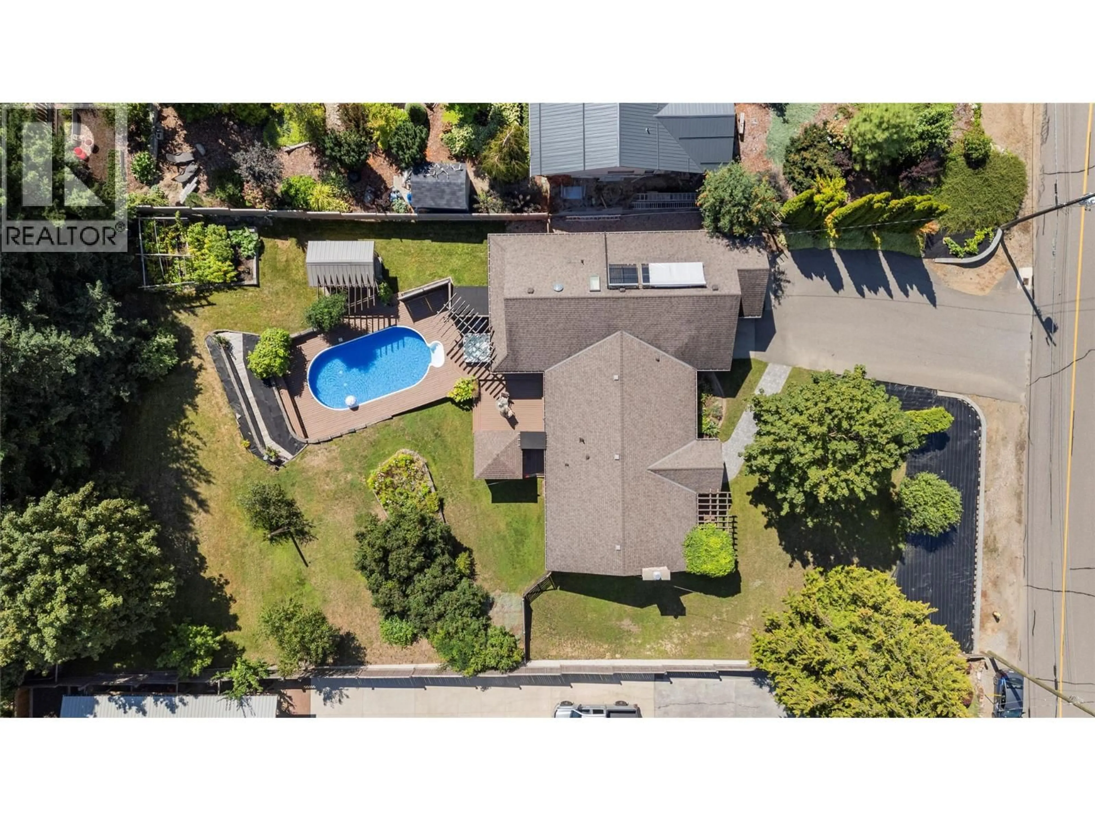 A pic from outside/outdoor area/front of a property/back of a property/a pic from drone, street for 2230 28 STREET NORTHEAST, Salmon Arm British Columbia V1E3E1