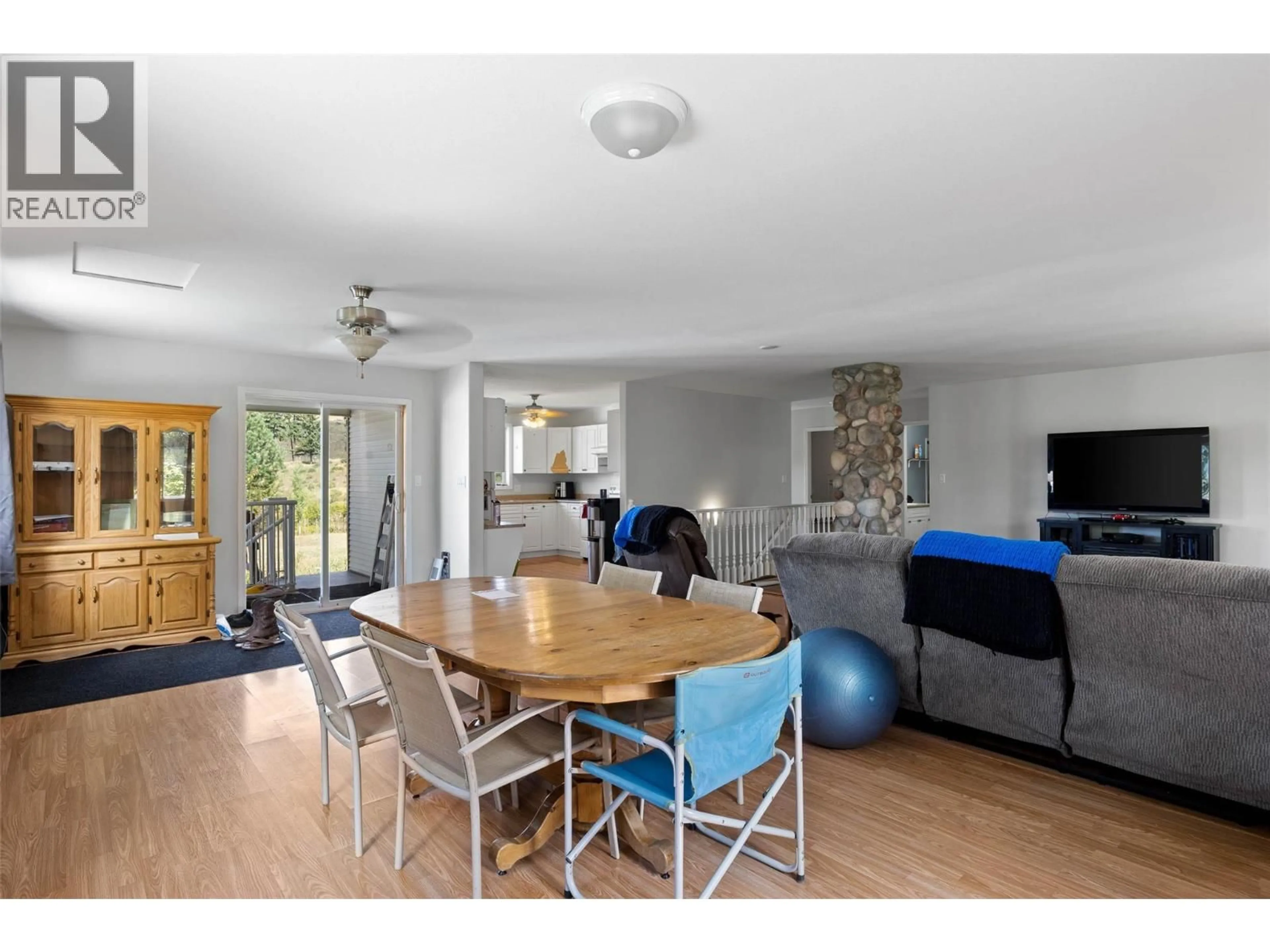 Living room with furniture, wood/laminate floor for 3998 AGATE BAY ROAD, Barriere British Columbia V0E2E0
