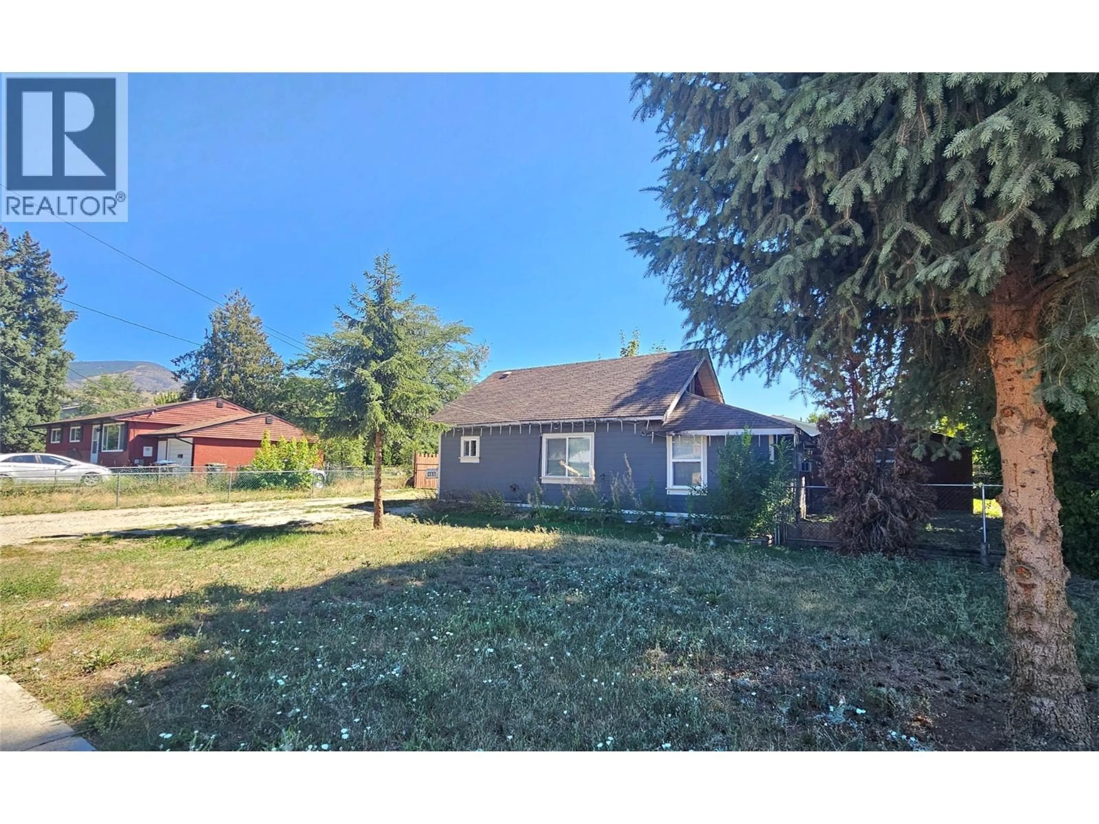 A pic from outside/outdoor area/front of a property/back of a property/a pic from drone, street for 465 MUGFORD ROAD, Kelowna British Columbia V1X2E5