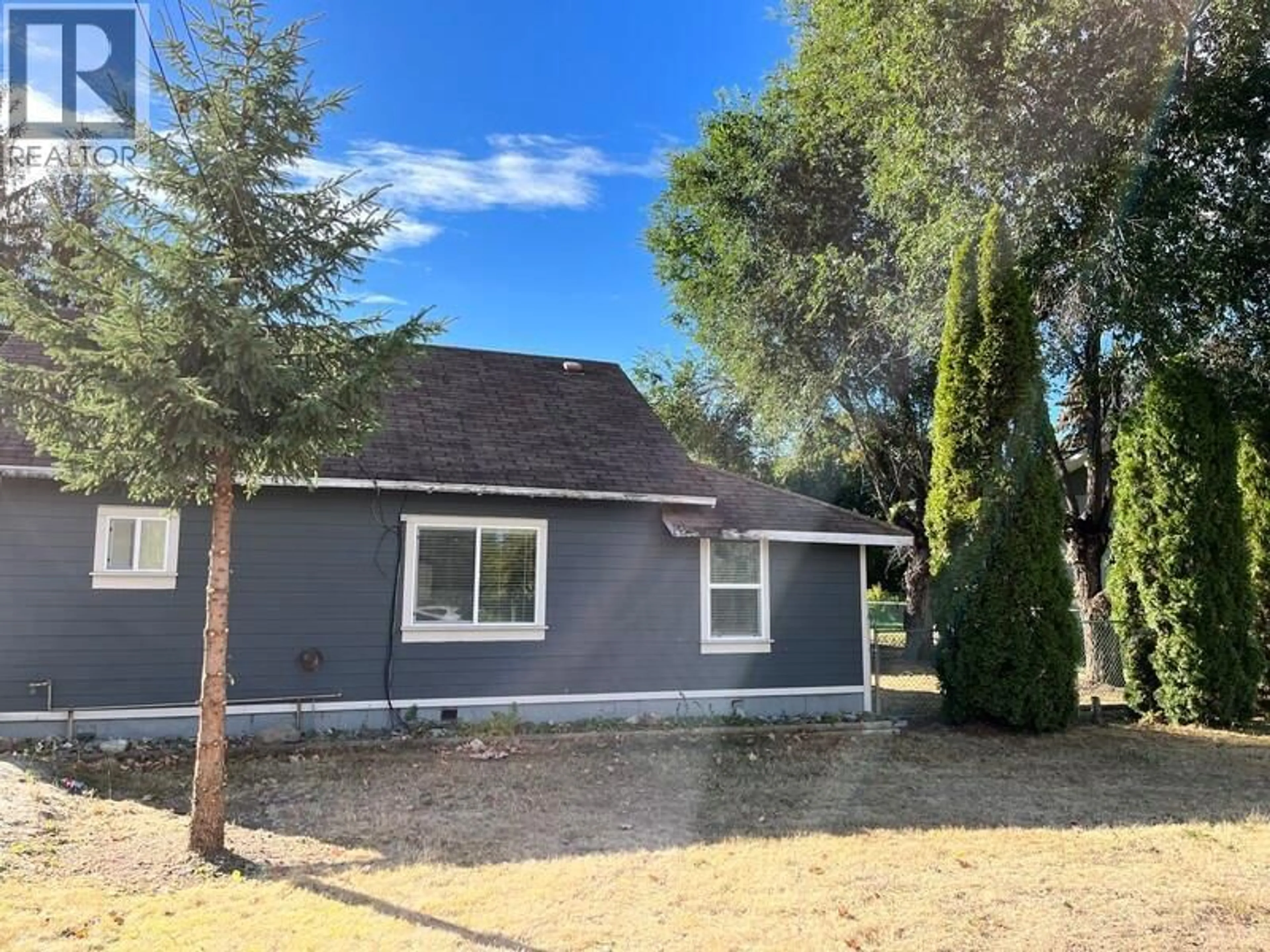 Home with vinyl exterior material, street for 465 MUGFORD ROAD, Kelowna British Columbia V1X2E5