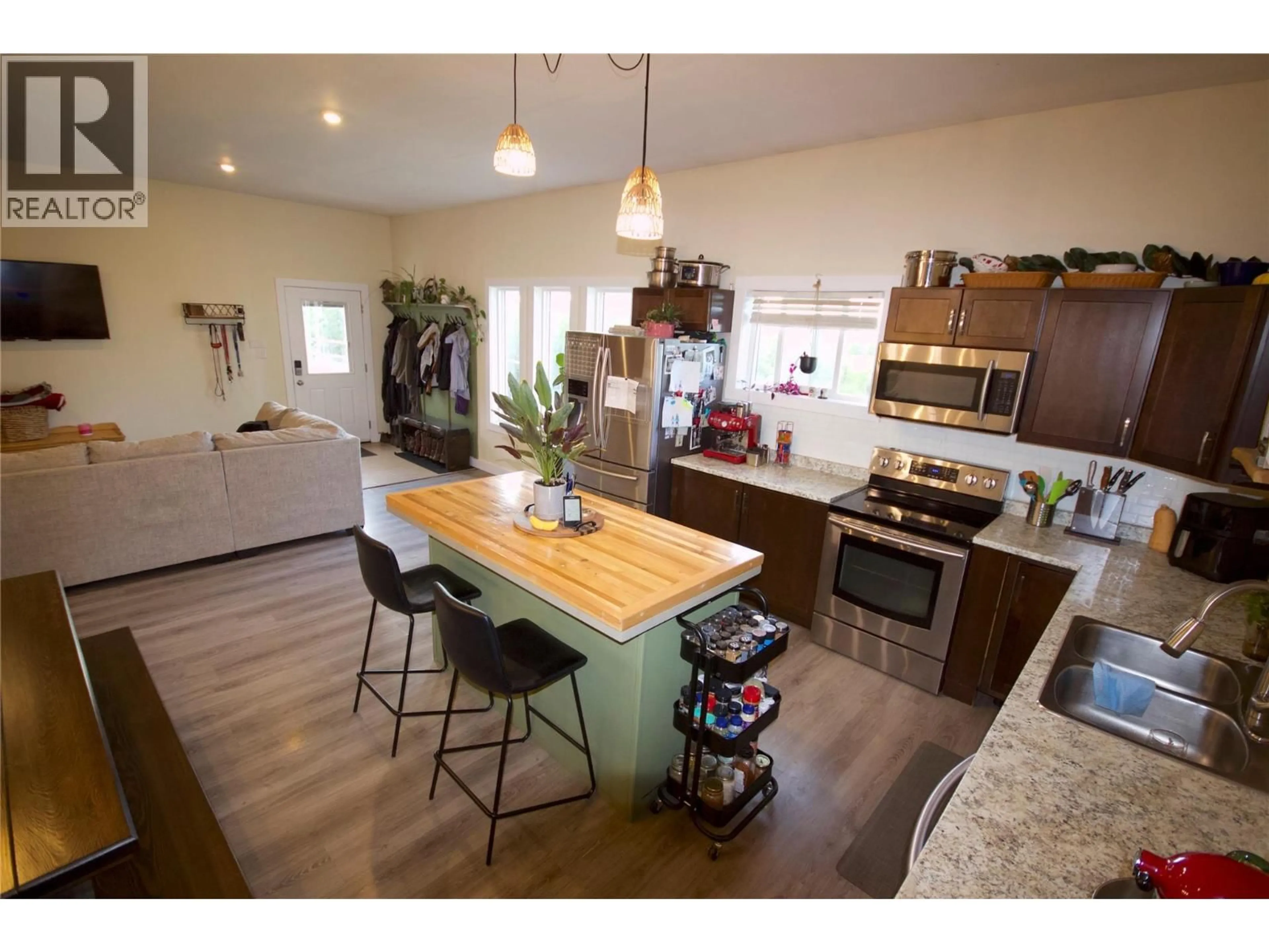 Open concept kitchen, wood/laminate floor for 184 DIAMOND WILLOW DRIVE, Dawson Creek British Columbia V1G1K8