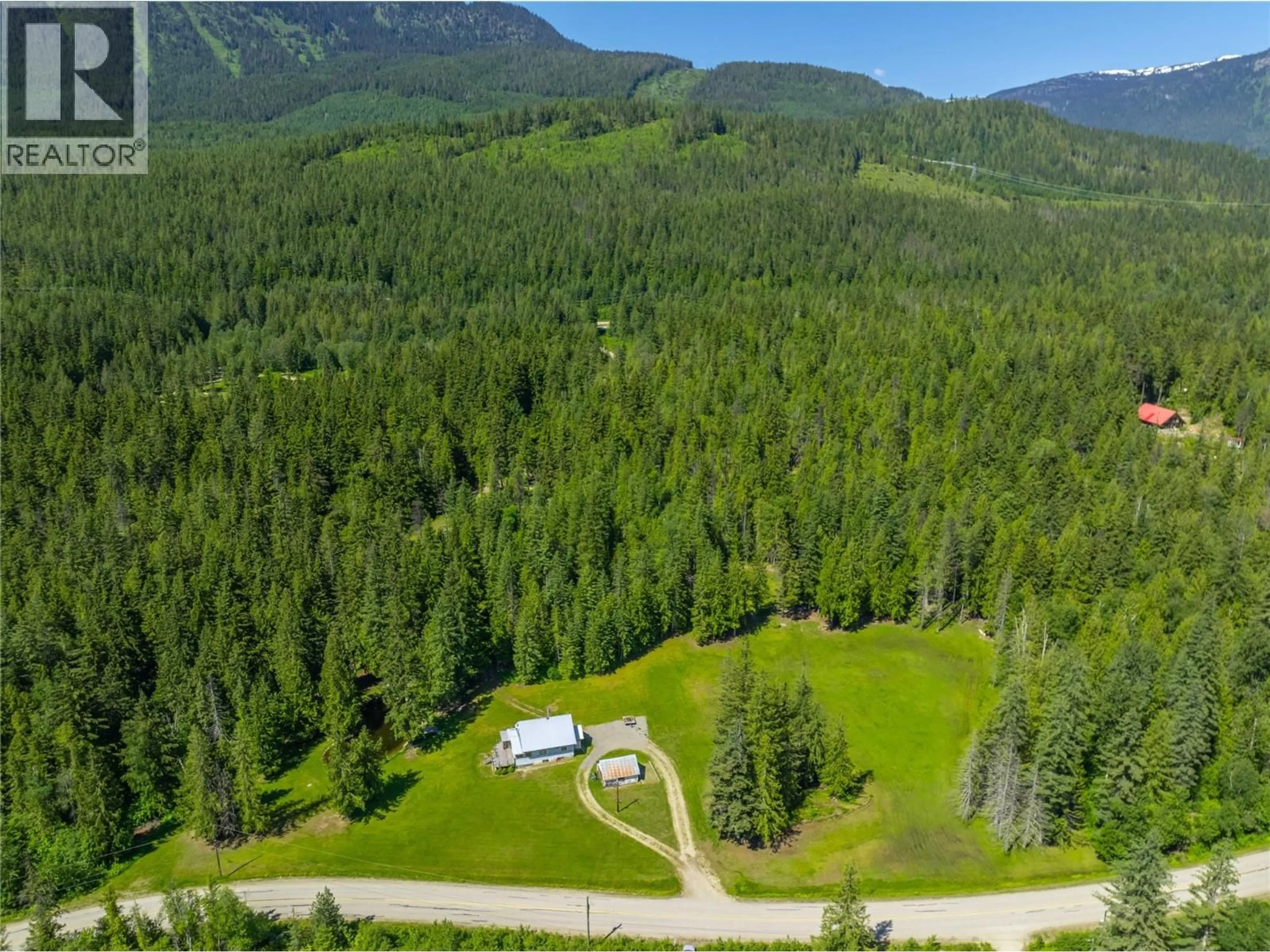 A pic from outside/outdoor area/front of a property/back of a property/a pic from drone, forest/trees view for 1734 MT BEGBIE ROAD, Revelstoke British Columbia V0E2s0