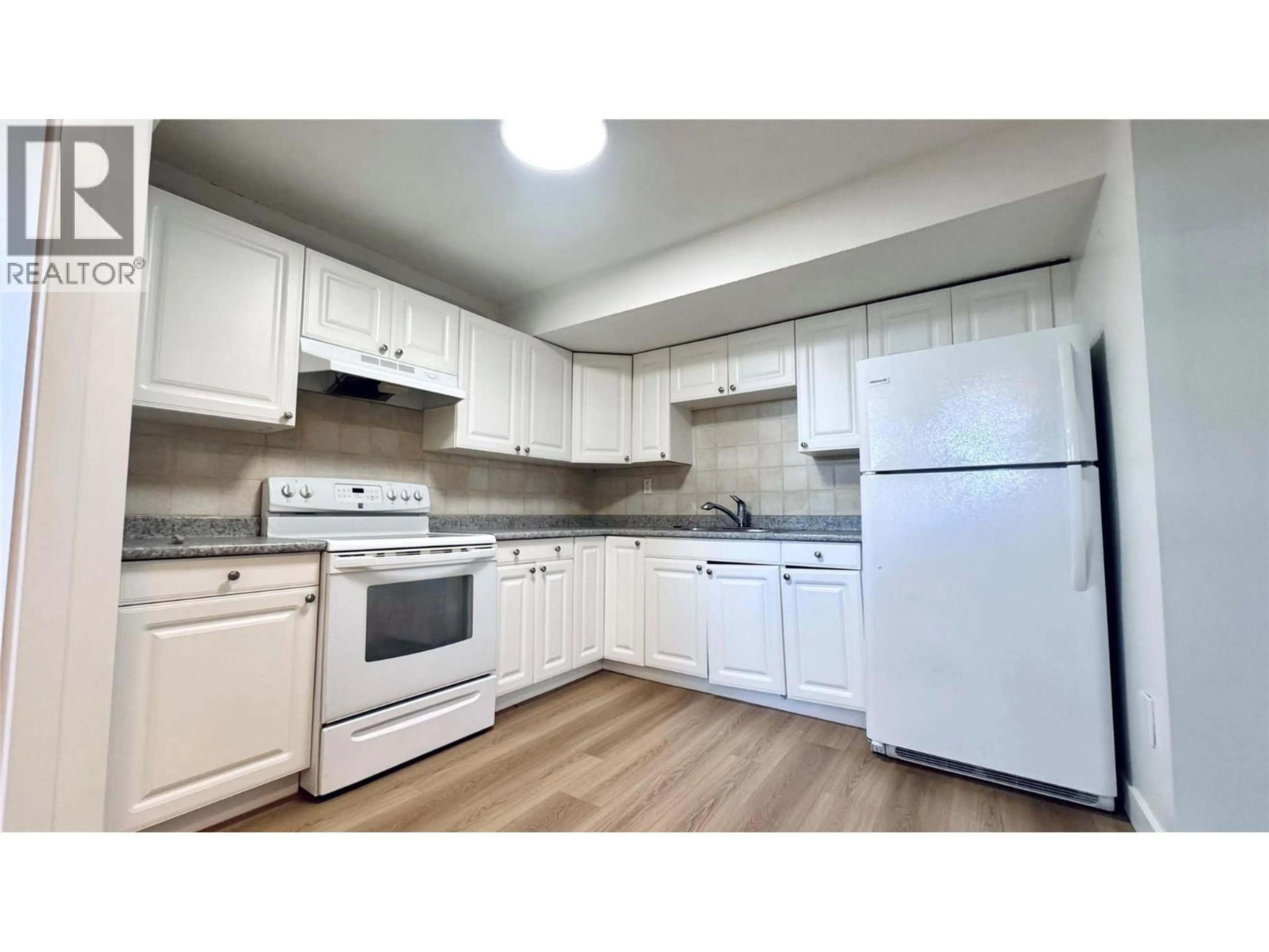 Standard kitchen, wood/laminate floor for 731 CUMBERLAND AVENUE, Kamloops British Columbia V2B8E4