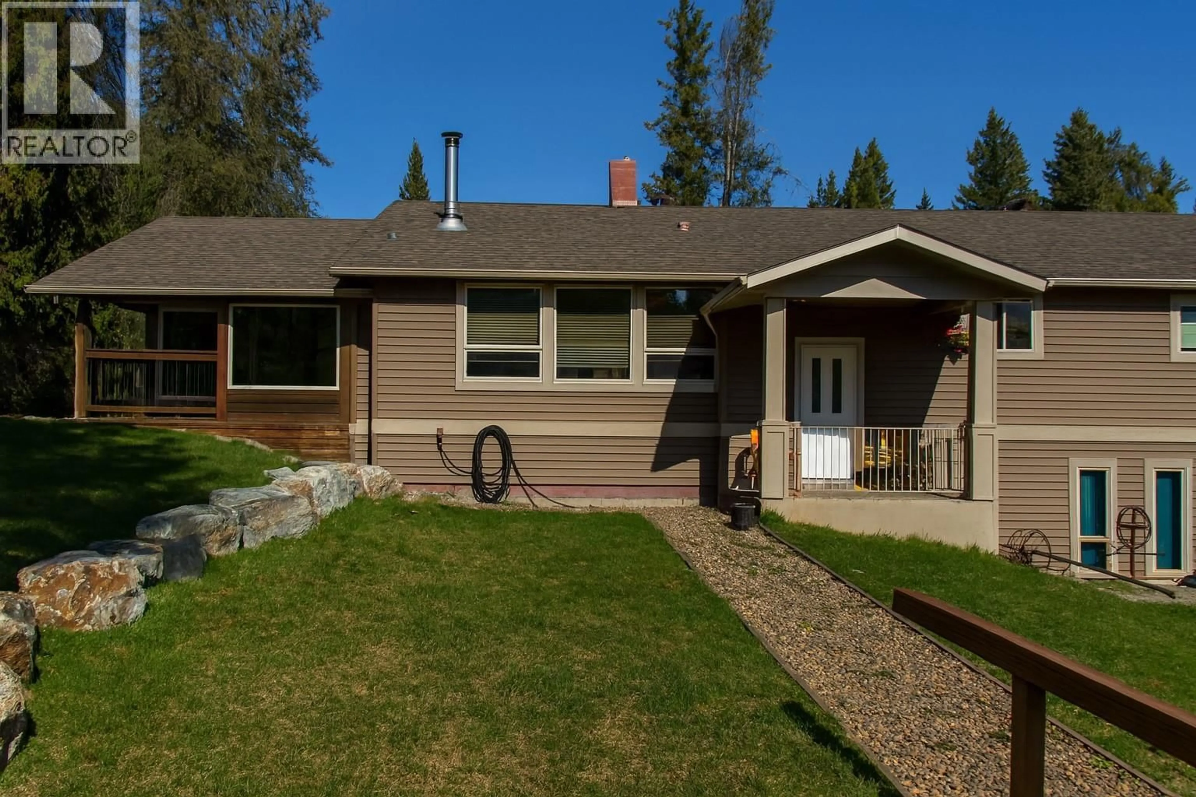 Home with vinyl exterior material, street for 348 CREIGHTON VALLEY ROAD, Lumby British Columbia V0E2G1